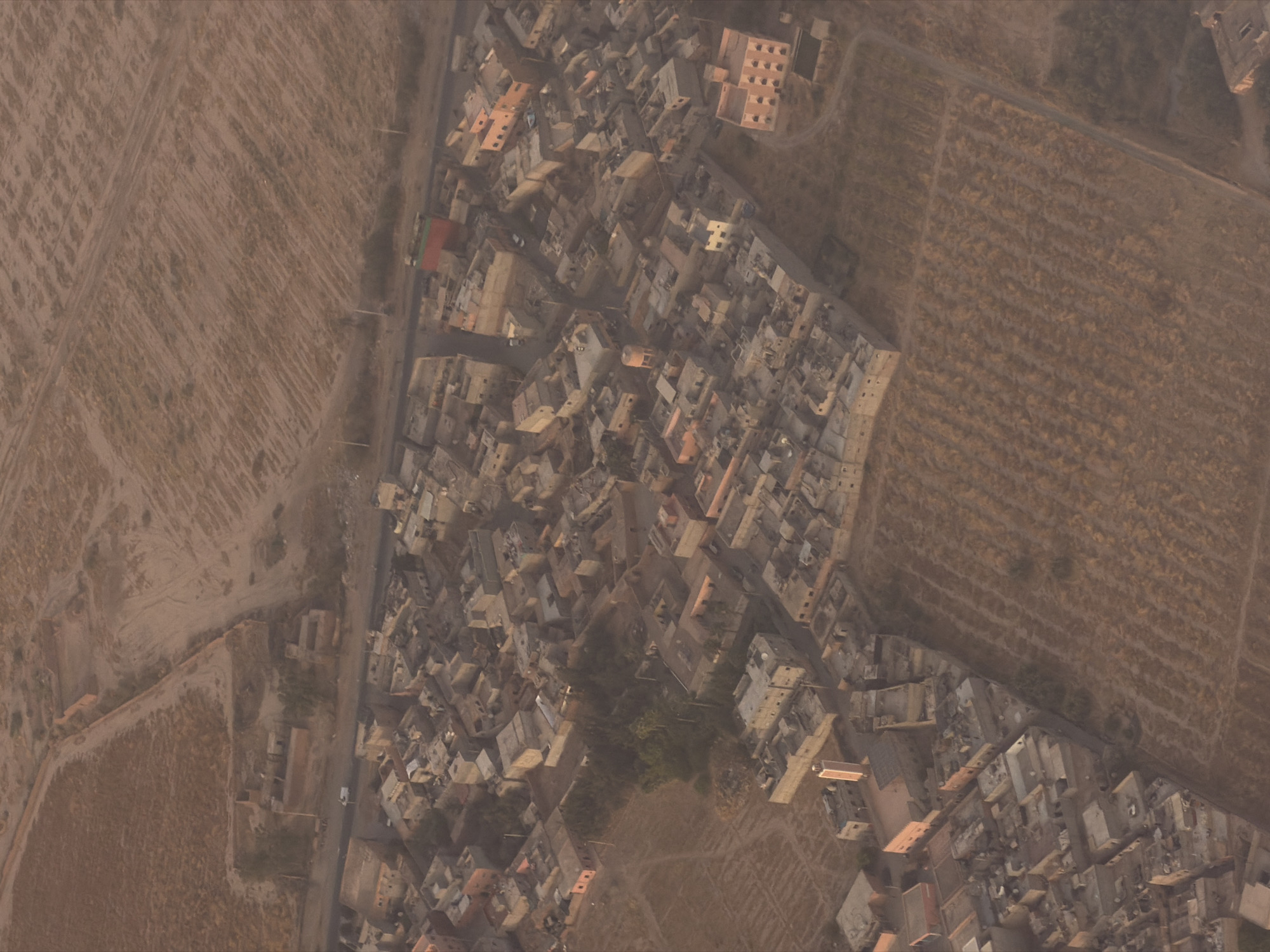 Aerial views over Marrakesh's urban fringe and farmland
