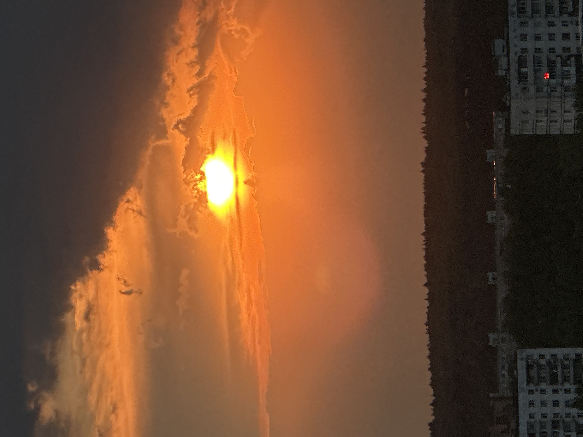 Dramatic sunset illuminates Krasnogorsk skyline with orange glow