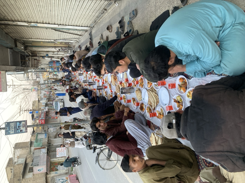 Community street meal brings dozens together in Quetta, Pakistan