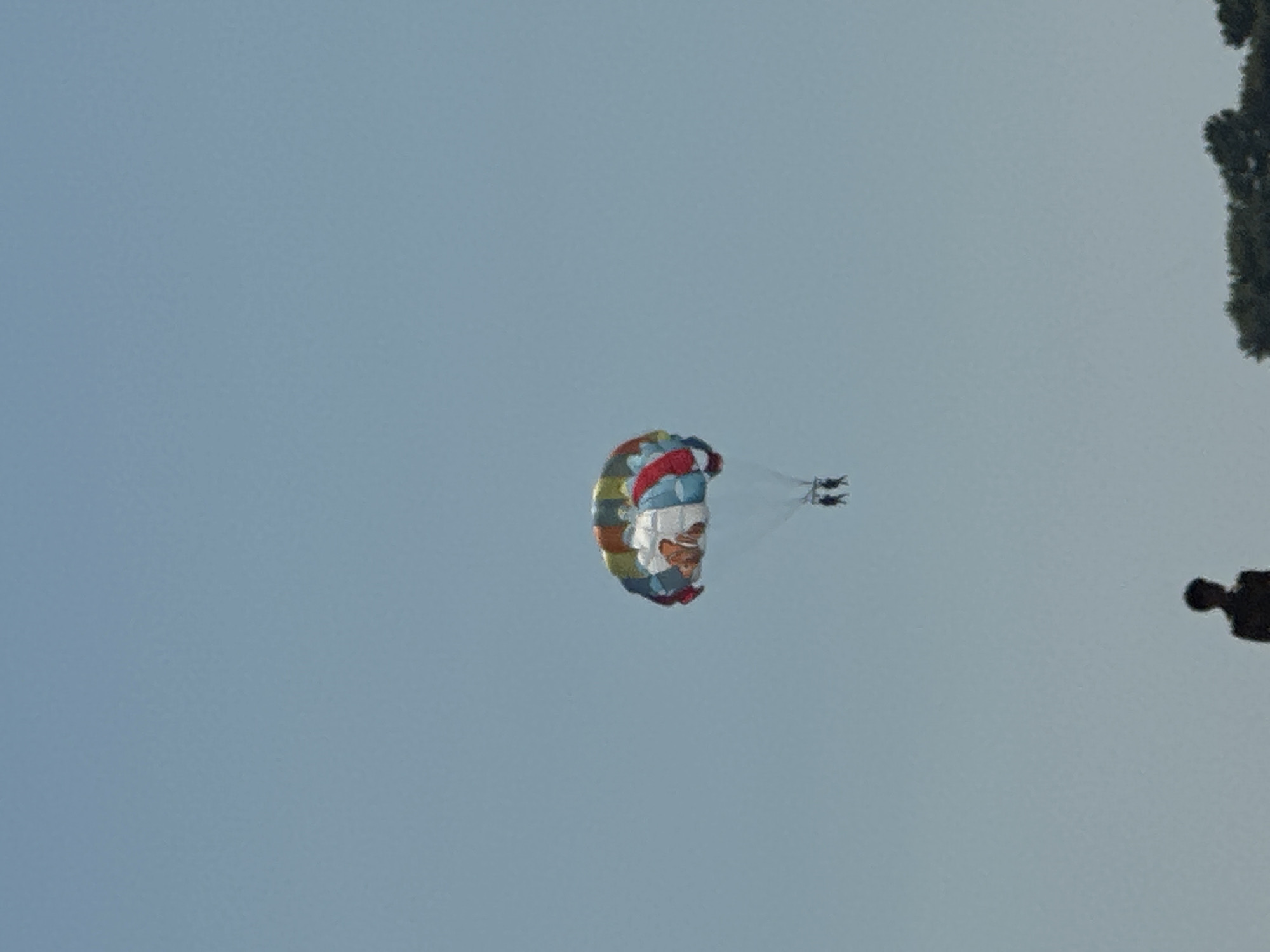 Summer afternoon of parasailing, swimming, and paddleboarding in Boreti