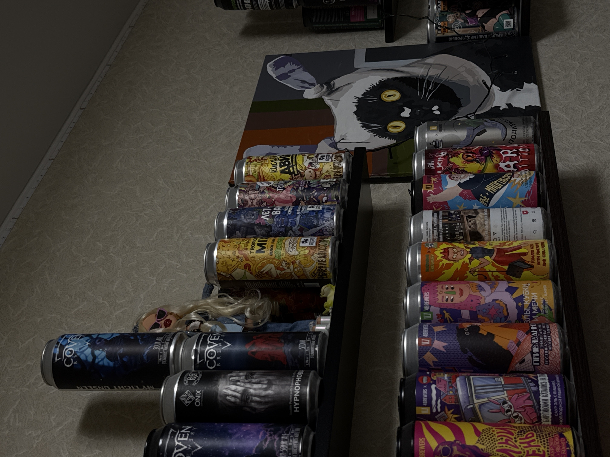 Cat-themed hangout spot with neon lights and stacked cans