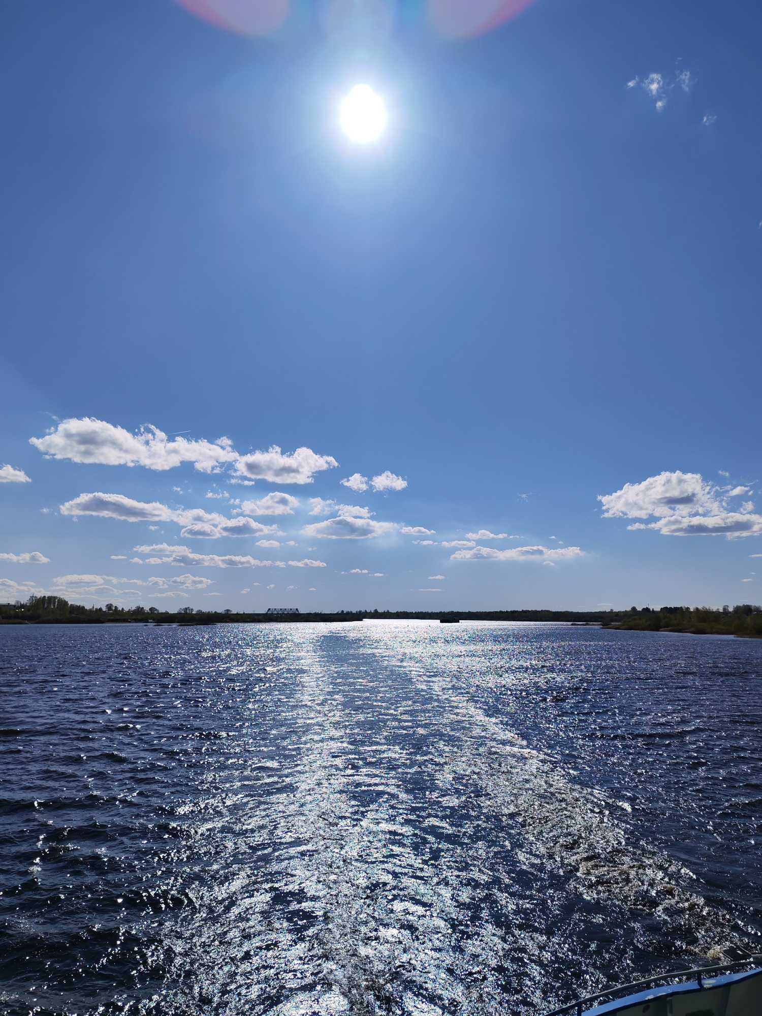 Sunny skies observed over water in Sheksna, Russia
