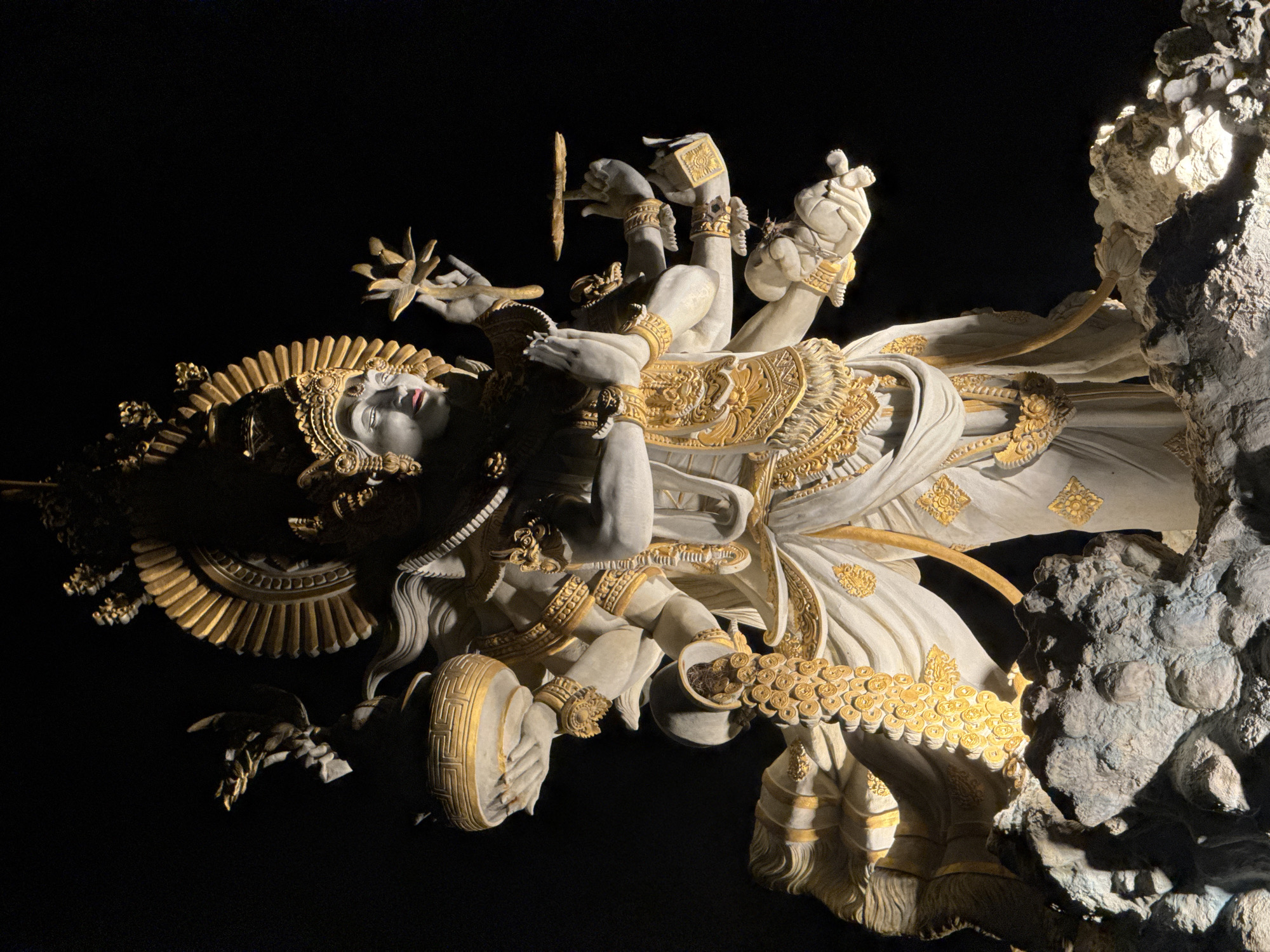 Multi-armed golden statue observed in North Kuta, Indonesia