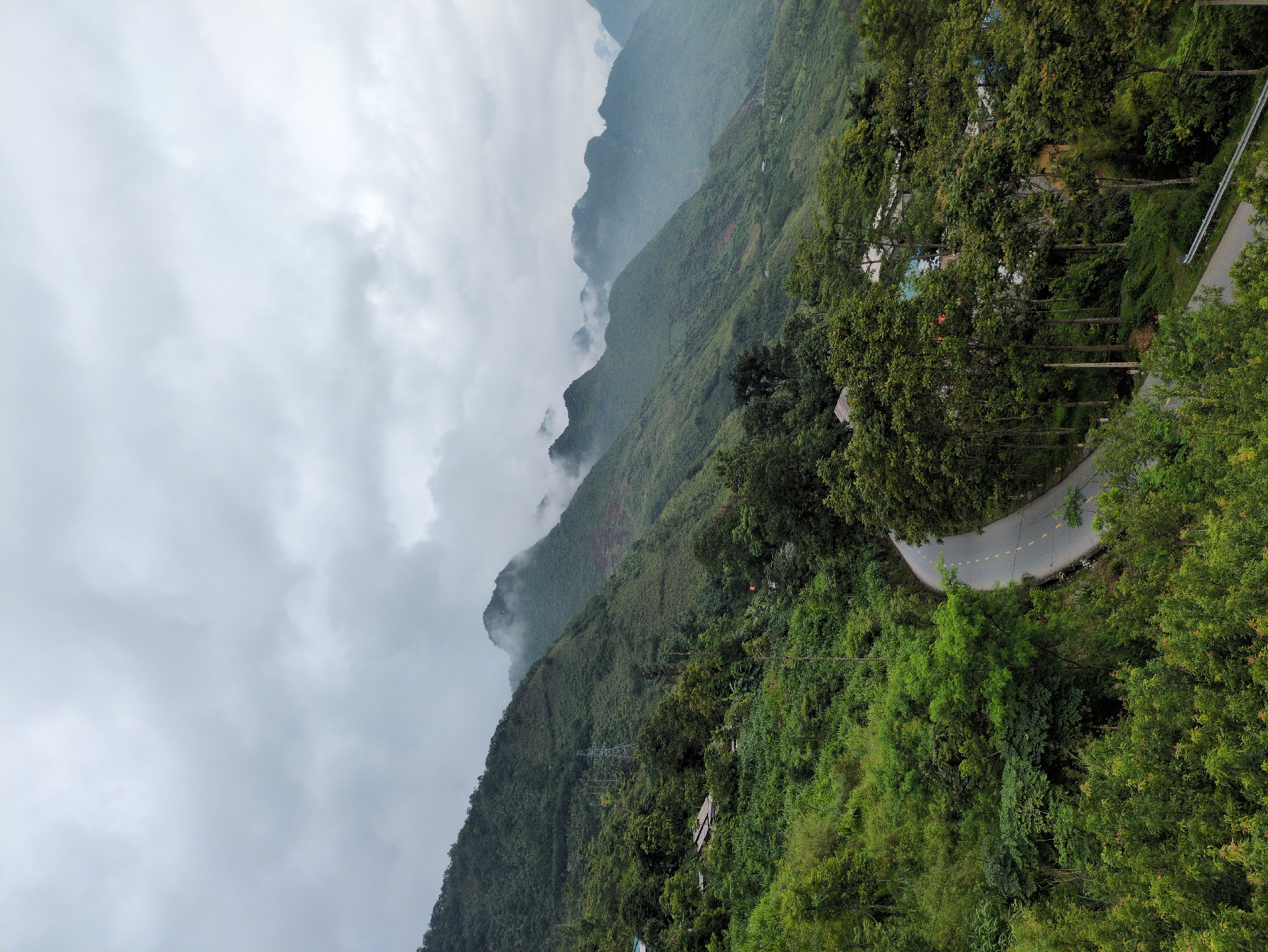 Taking in misty mountain views from a Lùng Tám viewpoint