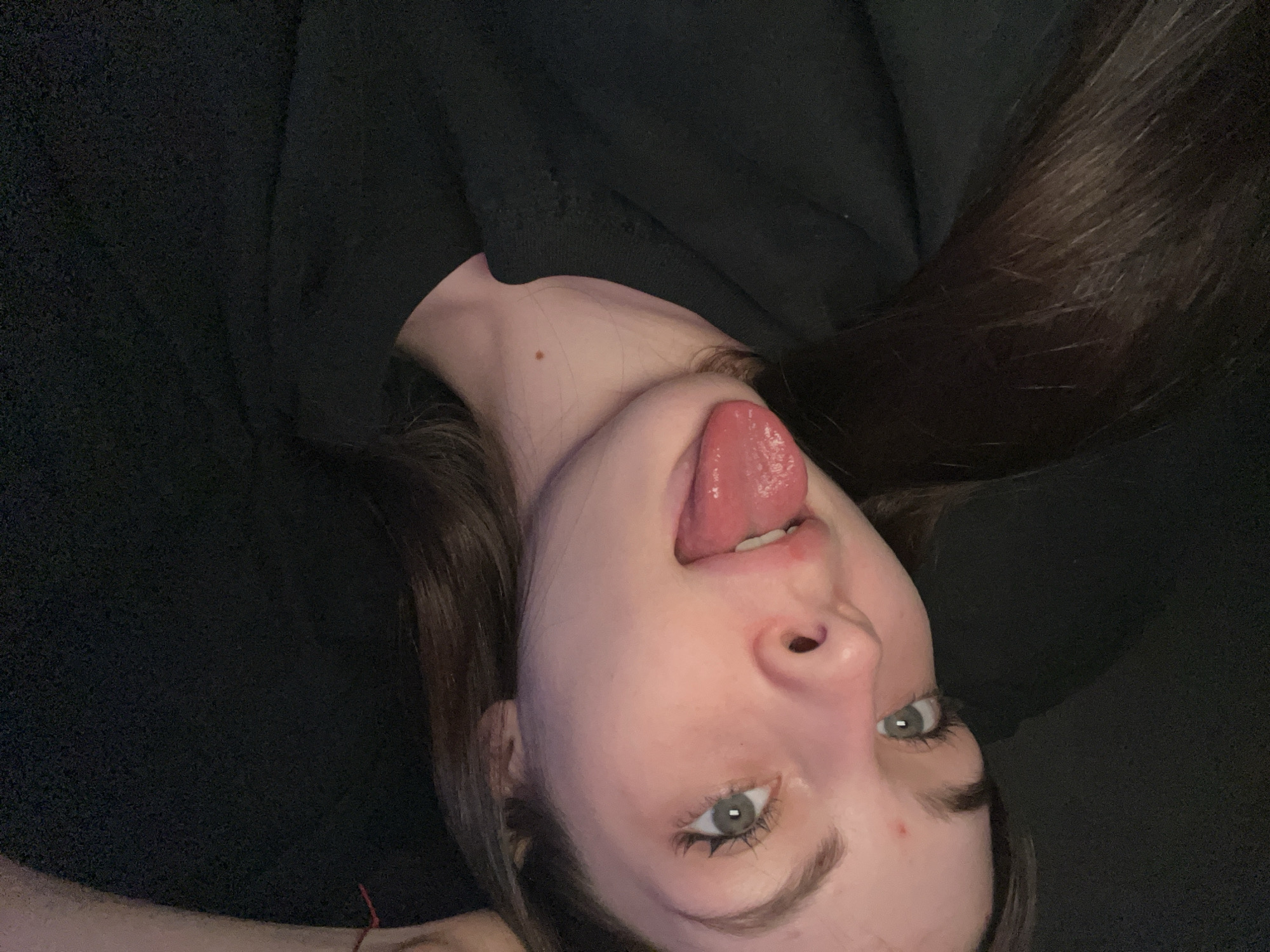 Woman documents selfies and artwork in Saint Petersburg bathroom