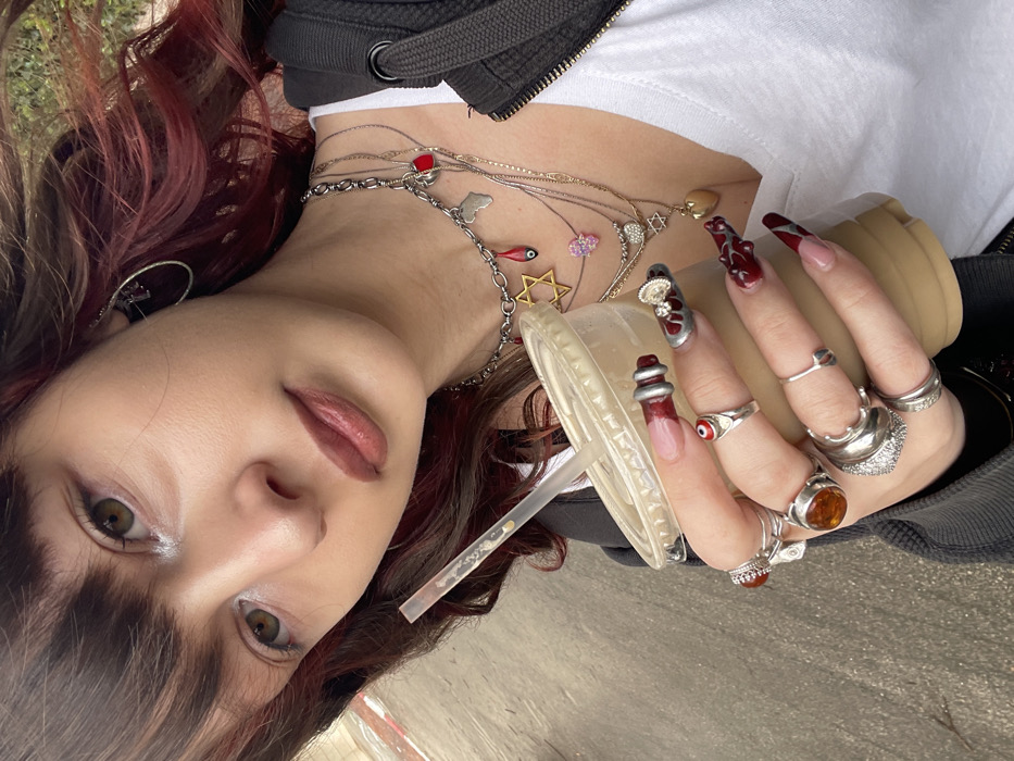 Young woman photographed multiple times across Raanana, Israel