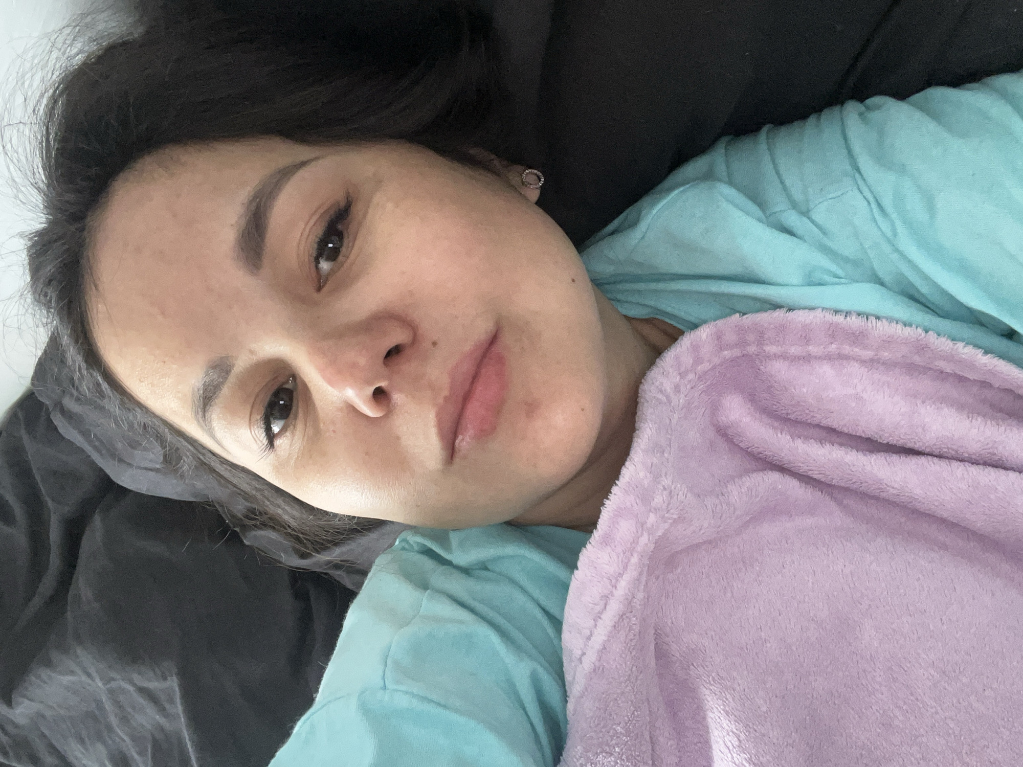 Woman rests in bed in Podolsk, Russia