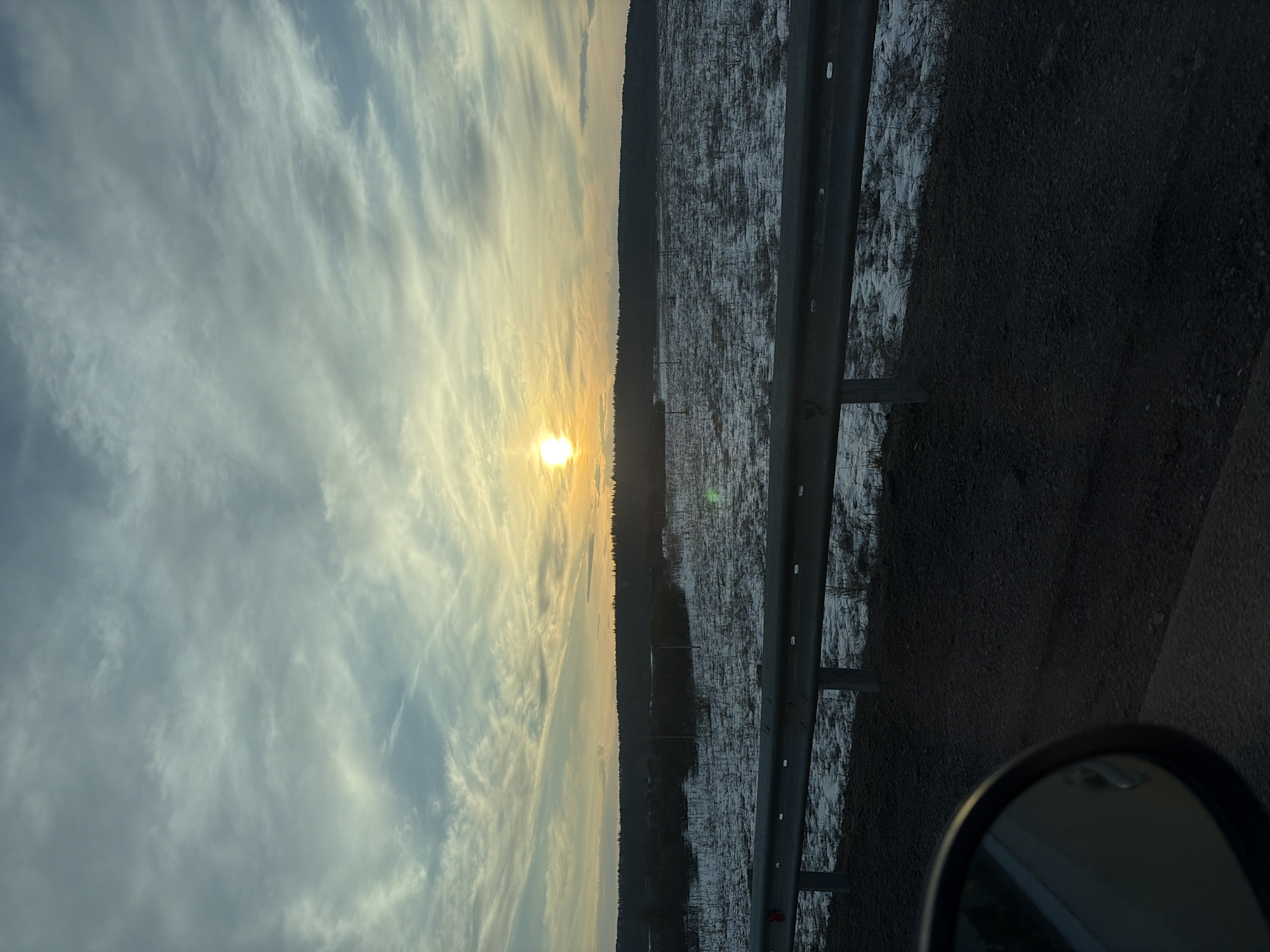 Vehicle passenger captures countryside road view near Chernovskoye, Russia