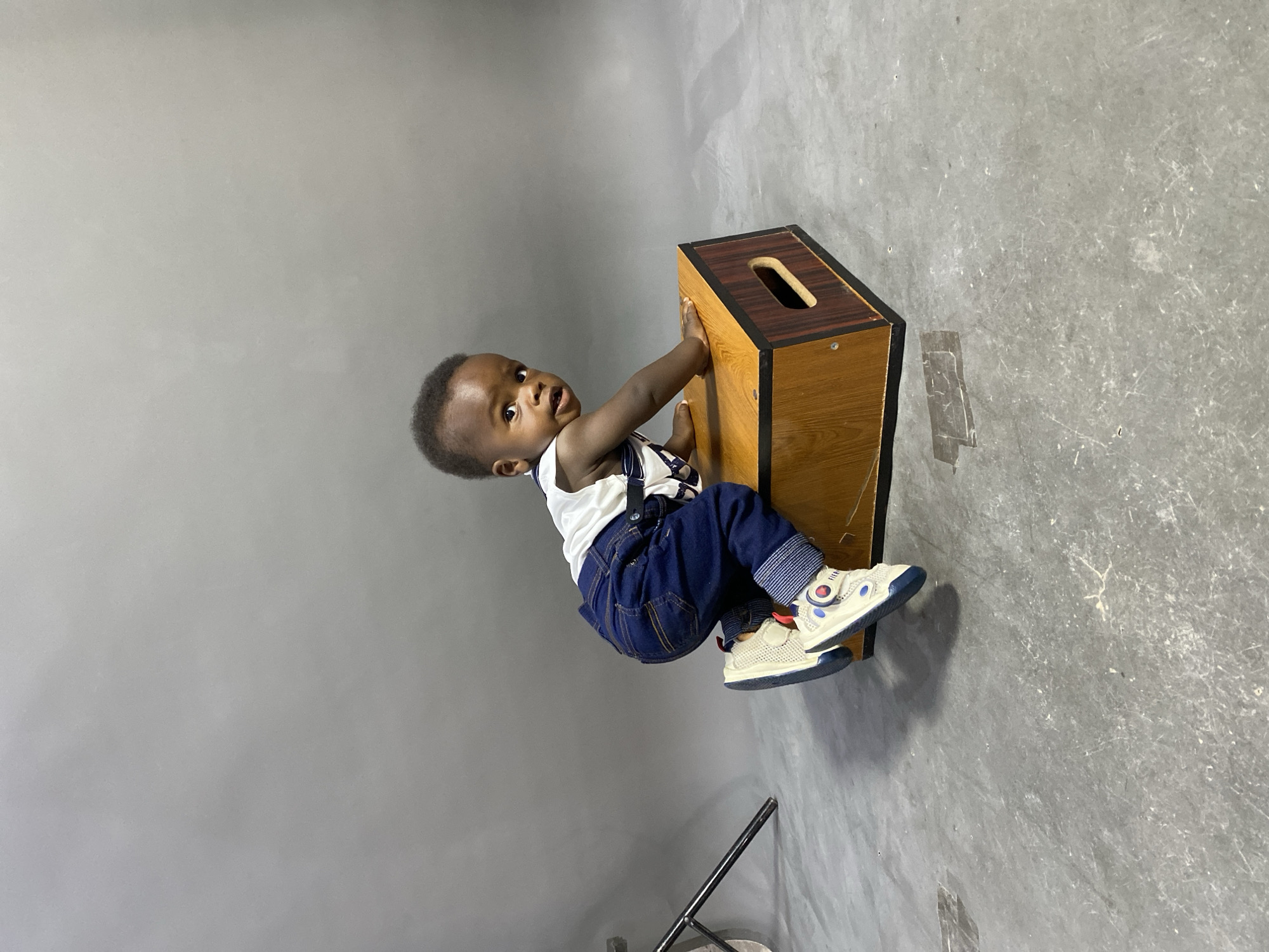 Toddler poses for studio photography session in Gura Top