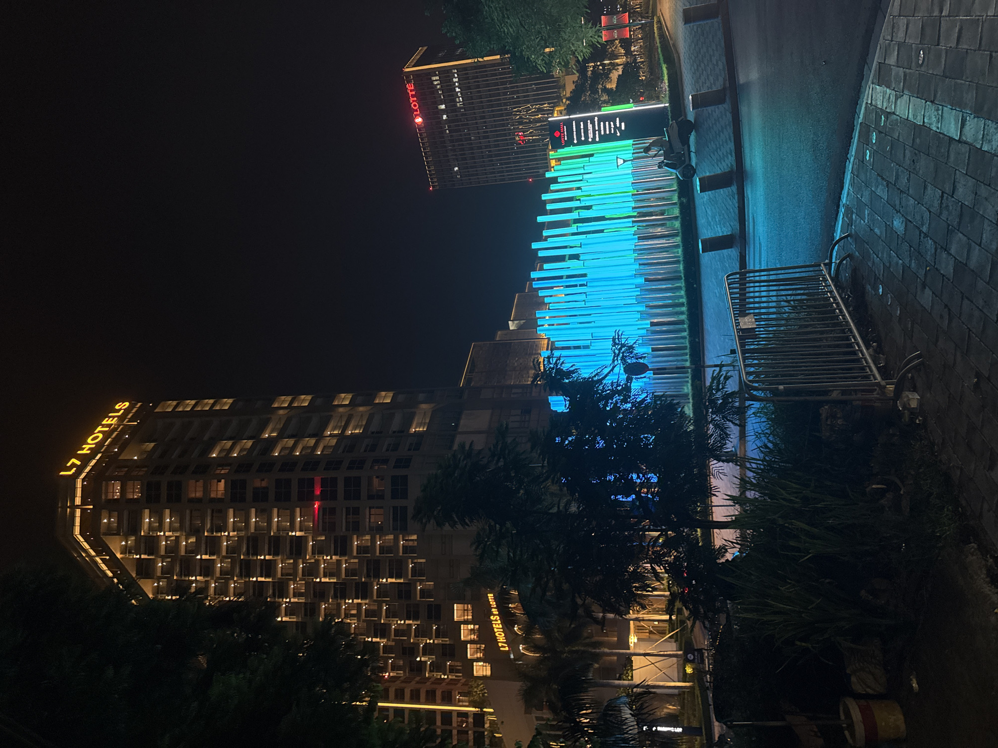 Lotte Center Hanoi at night, streets and sculptures lit up