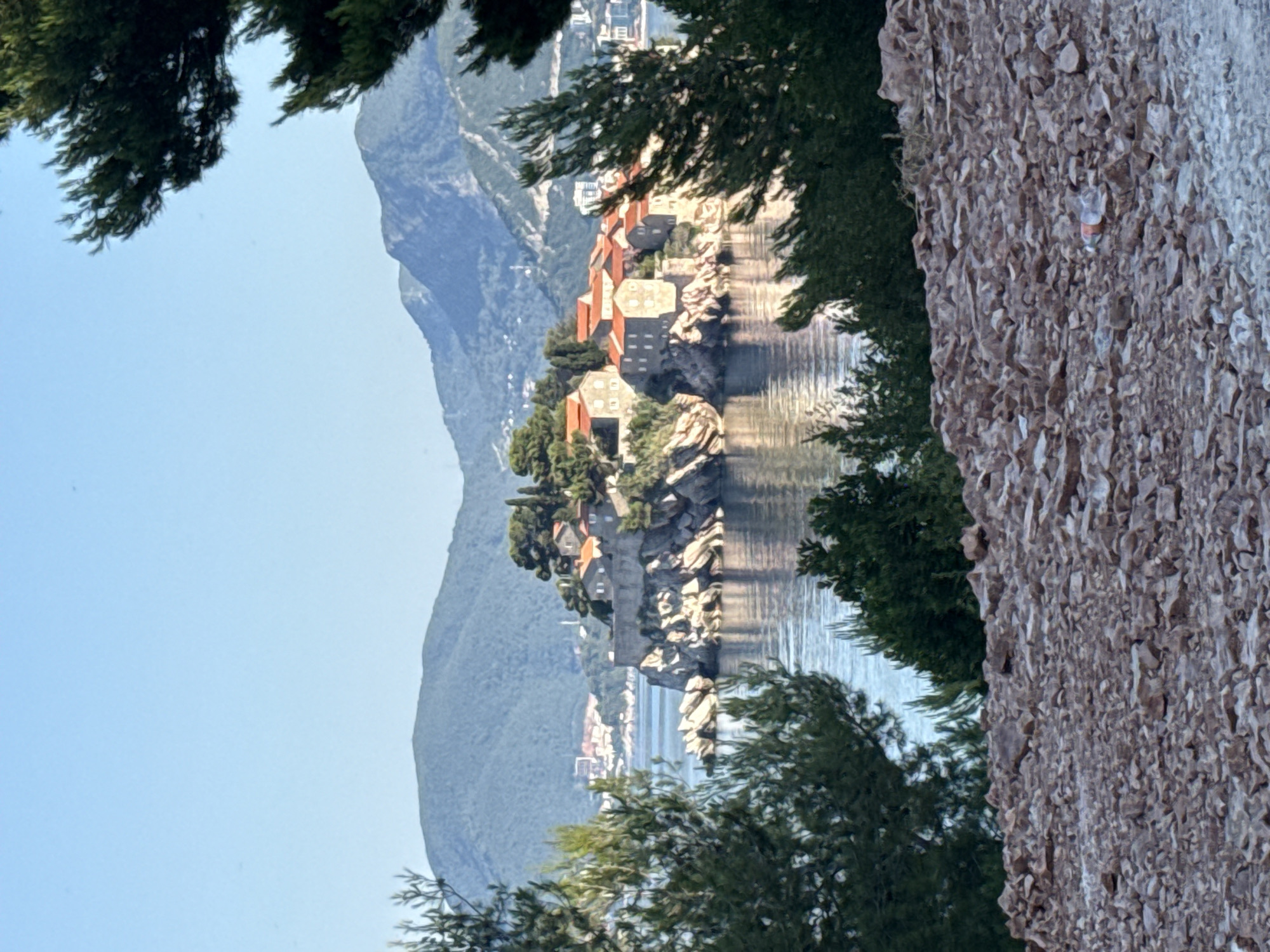 Driving and exploring around Sveti Stefan's coastal roads and shoreline