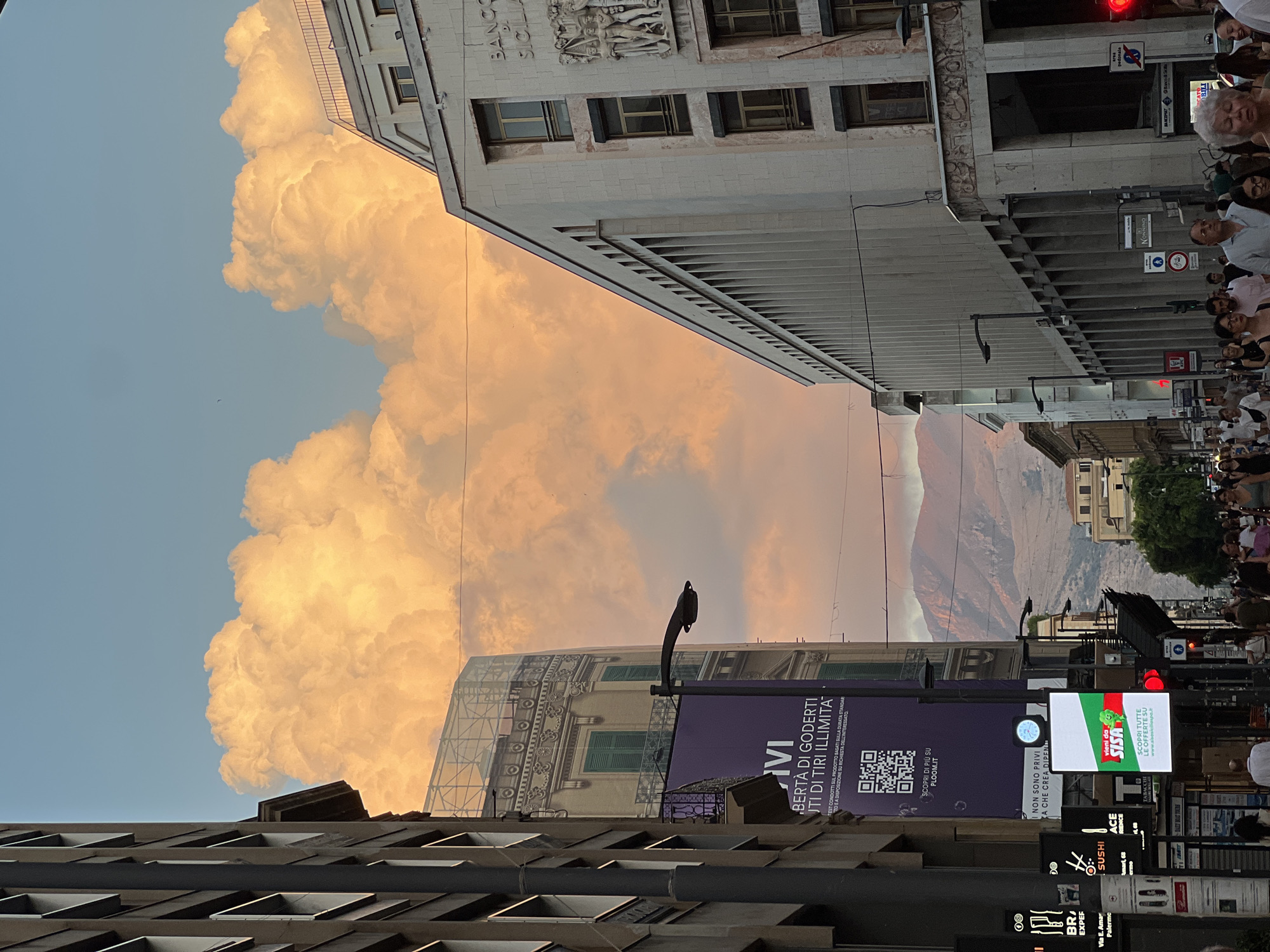 Golden sunset cloud dominates the sky over Palermo streets