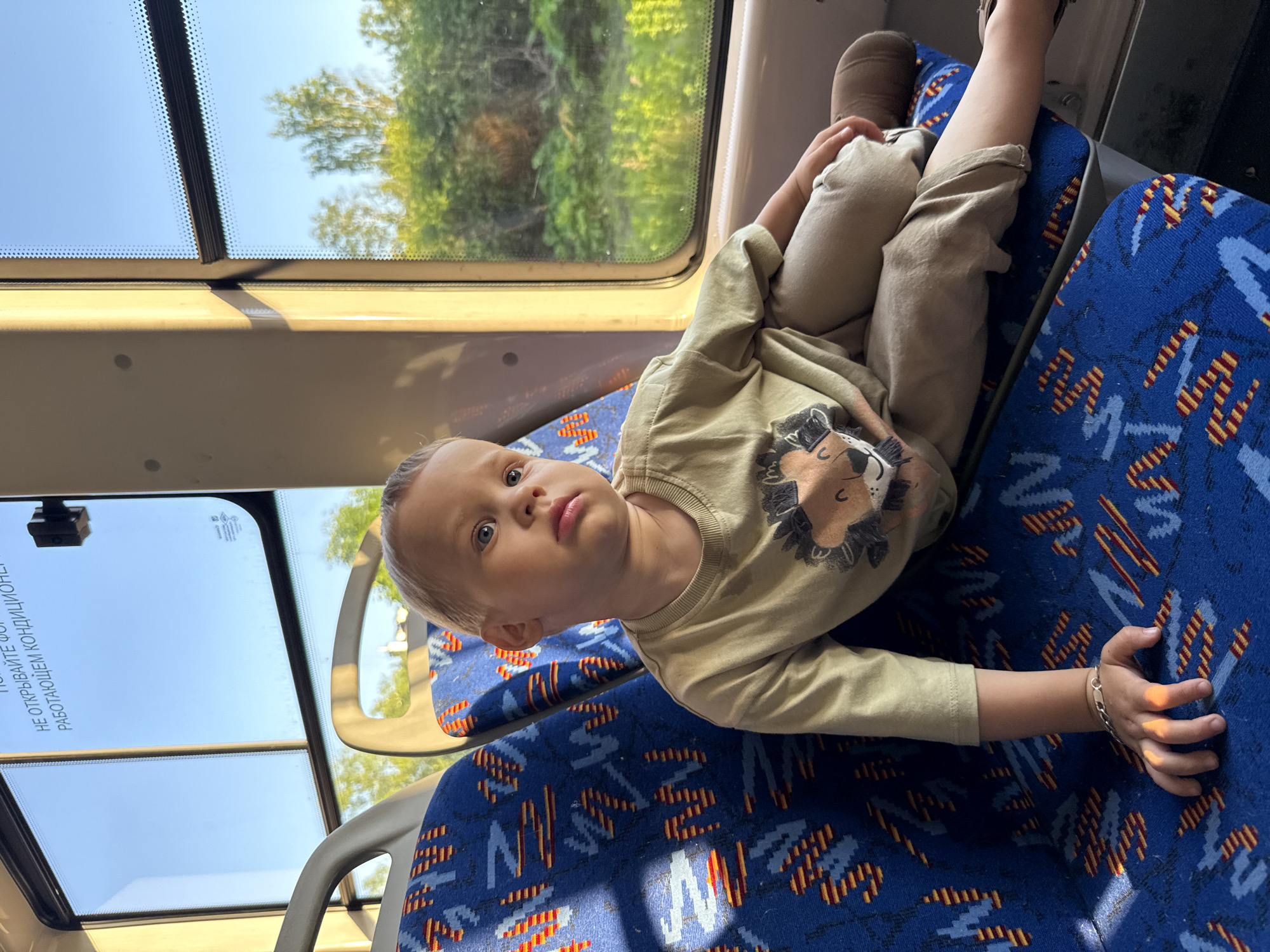 Woman and child ride public transport in Rusanovo