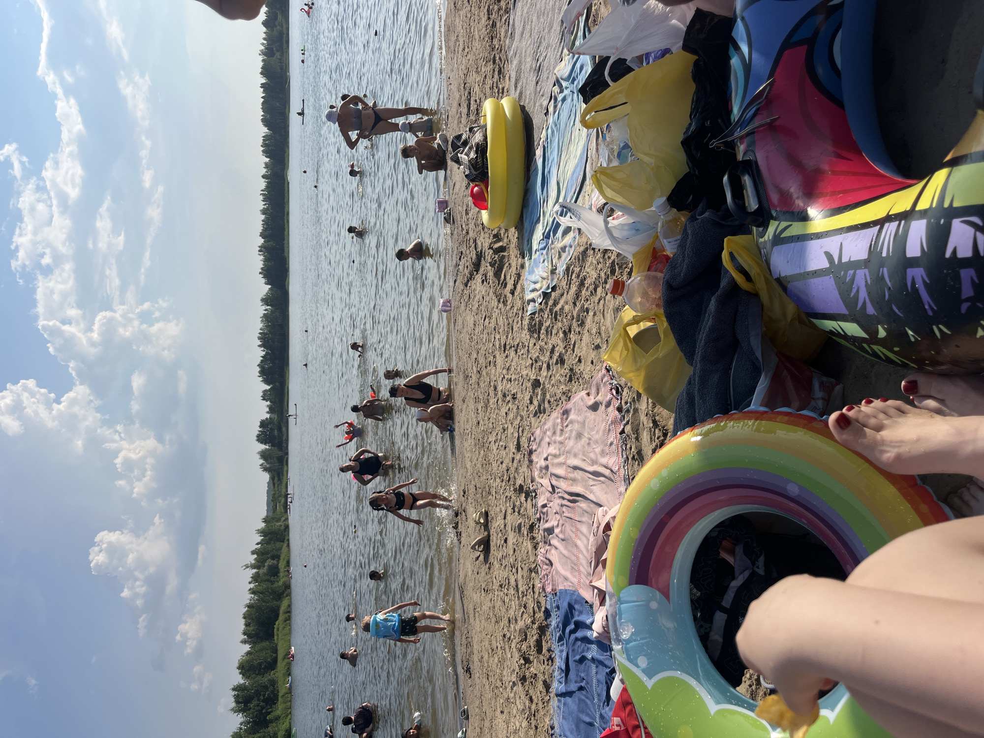 Tyumen's city beach packed on a hot summer afternoon