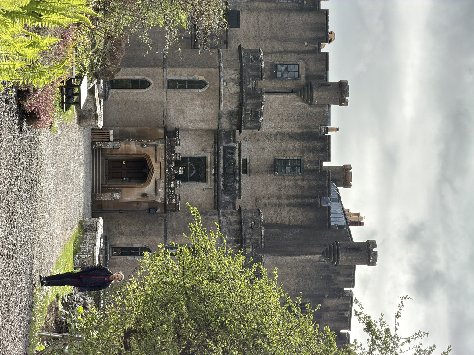 Visitors explore historic Dunvegan Castle grounds on spring afternoon