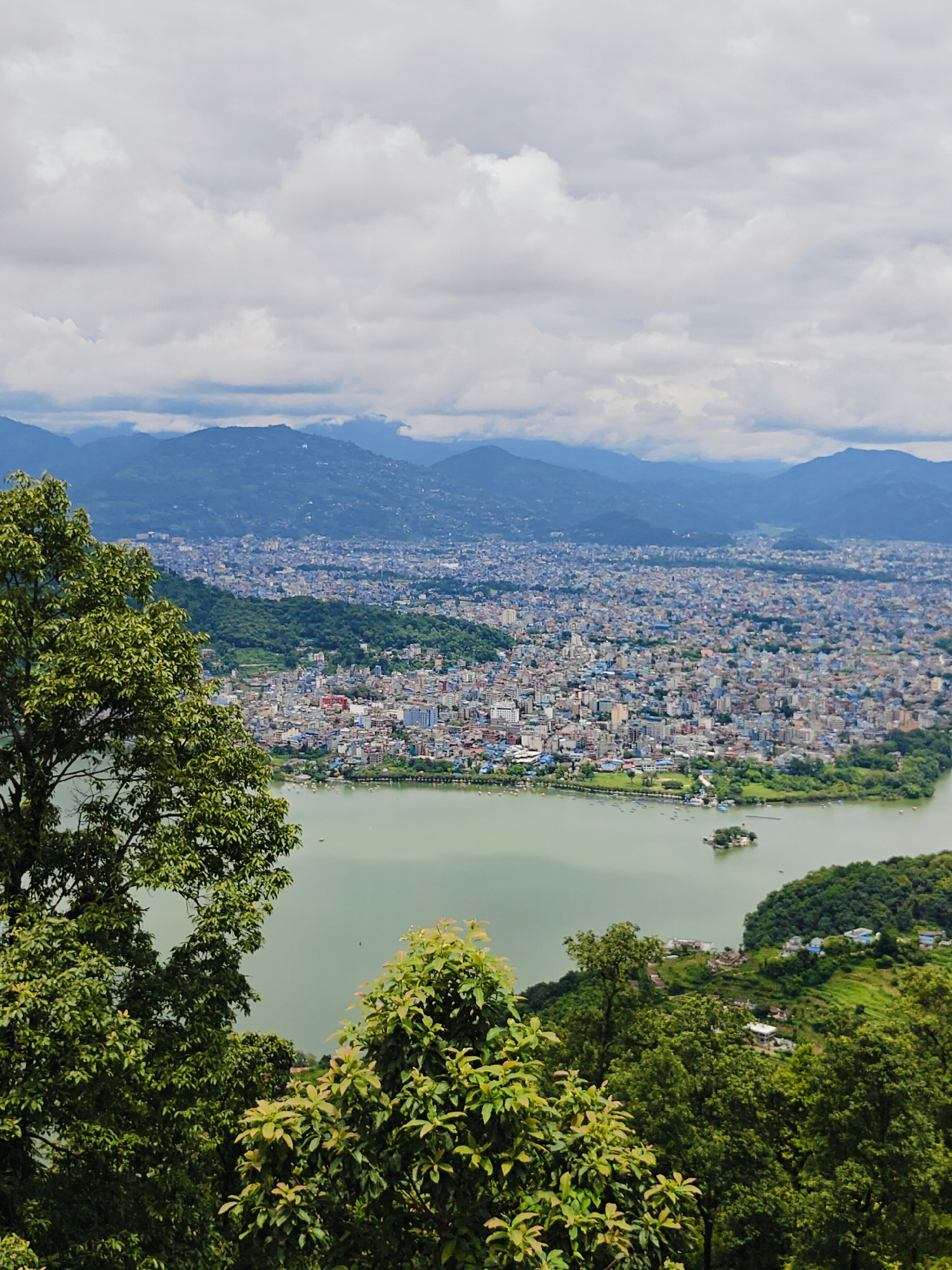 Hilltop views of Pokhara, Phewa Lake, and rural hillside life
