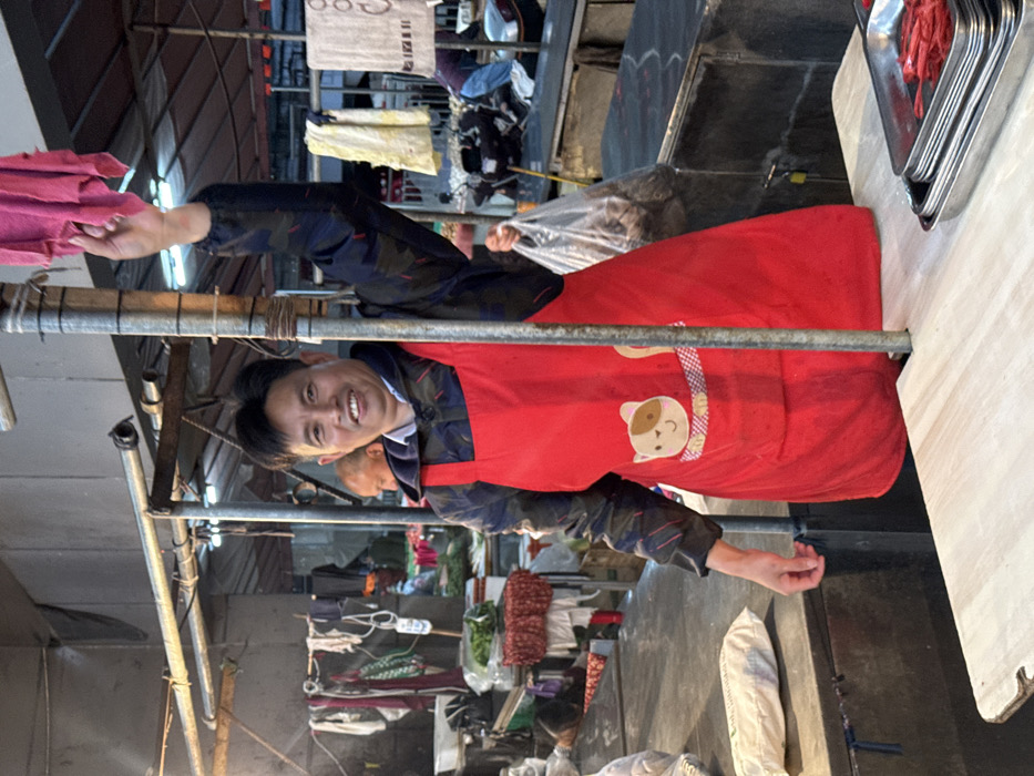 Morning life continues in rain-soaked Jiangjin markets and streets
