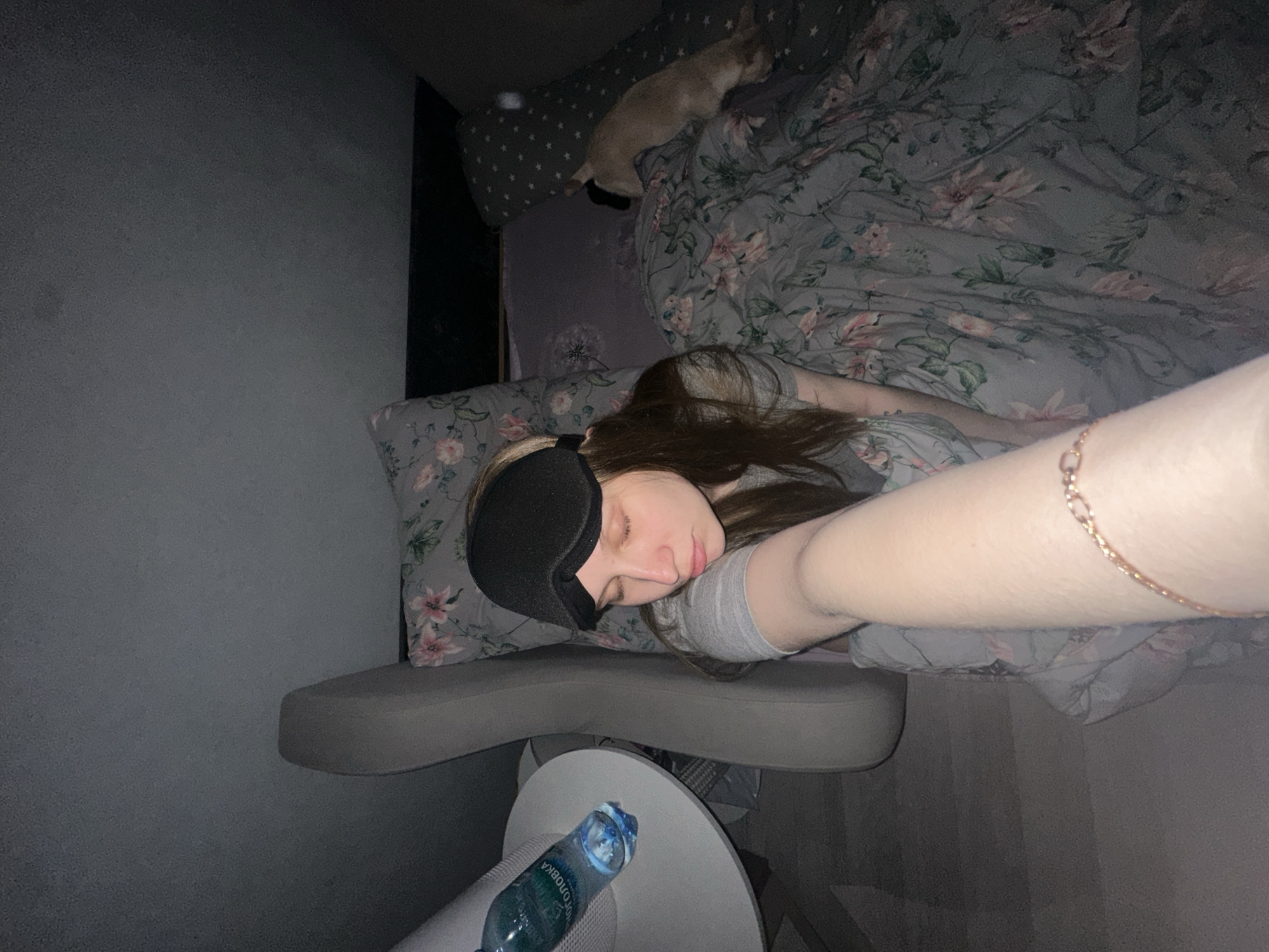 Woman rests with sleep mask in Chaikovsky bedroom
