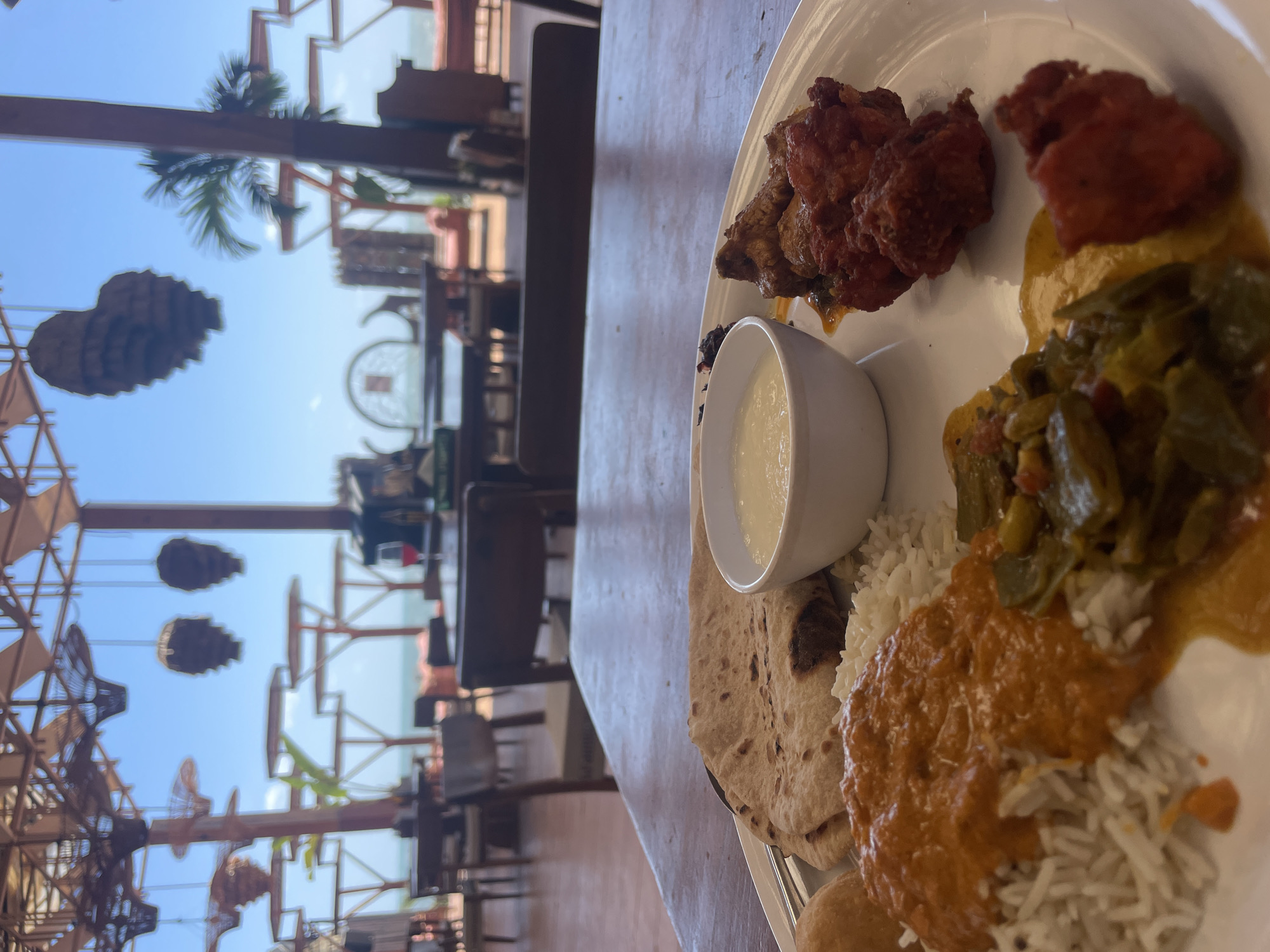 Traditional meal and ornate emblem documented in Chopdem, India