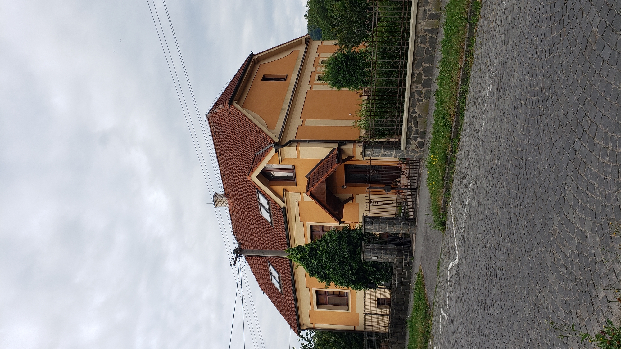 Prešov streets, waterways, and buildings on a quiet July morning