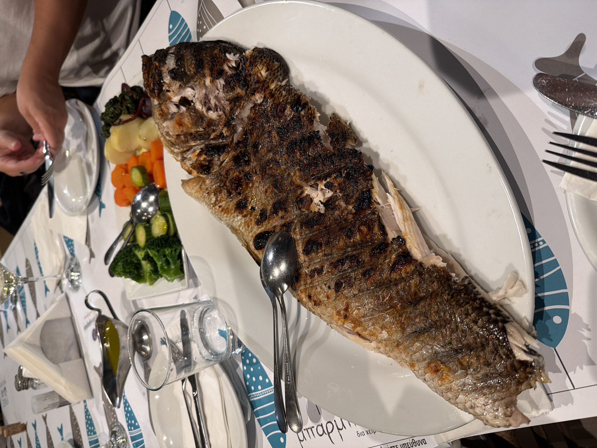 Grilled fish served at restaurant in Glifada, Greece