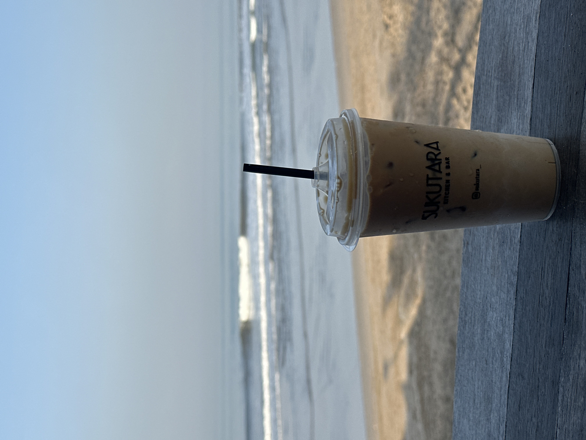 Lazy beach morning in North Kuta with dogs, babies, and iced coffee