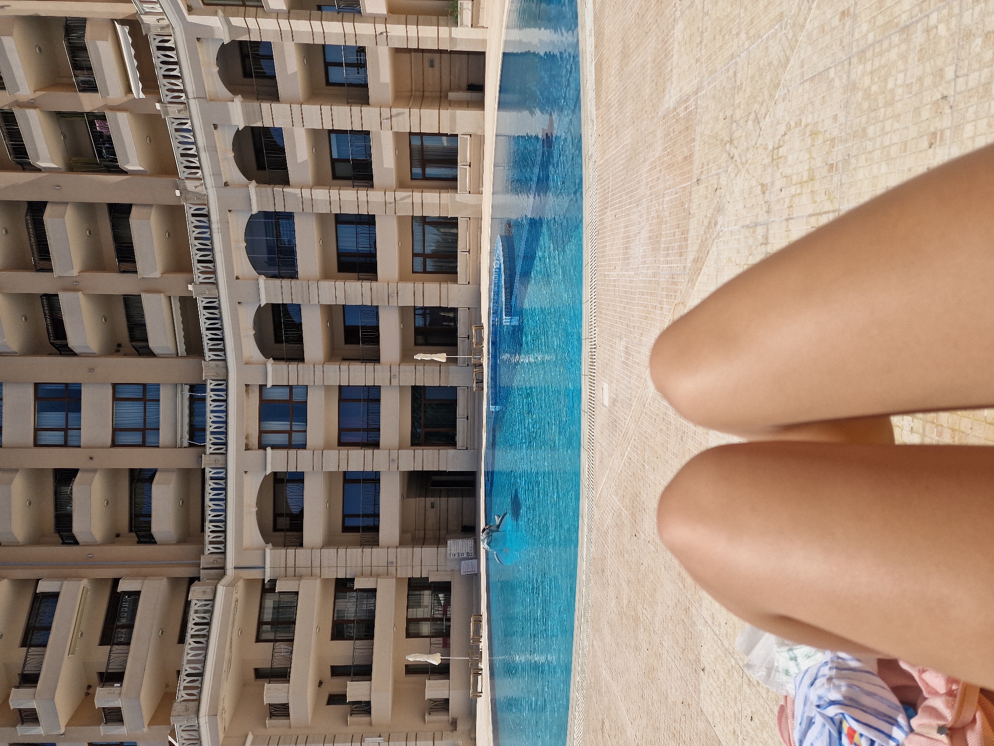 Pool dive captured from patio perspective at morning swim
