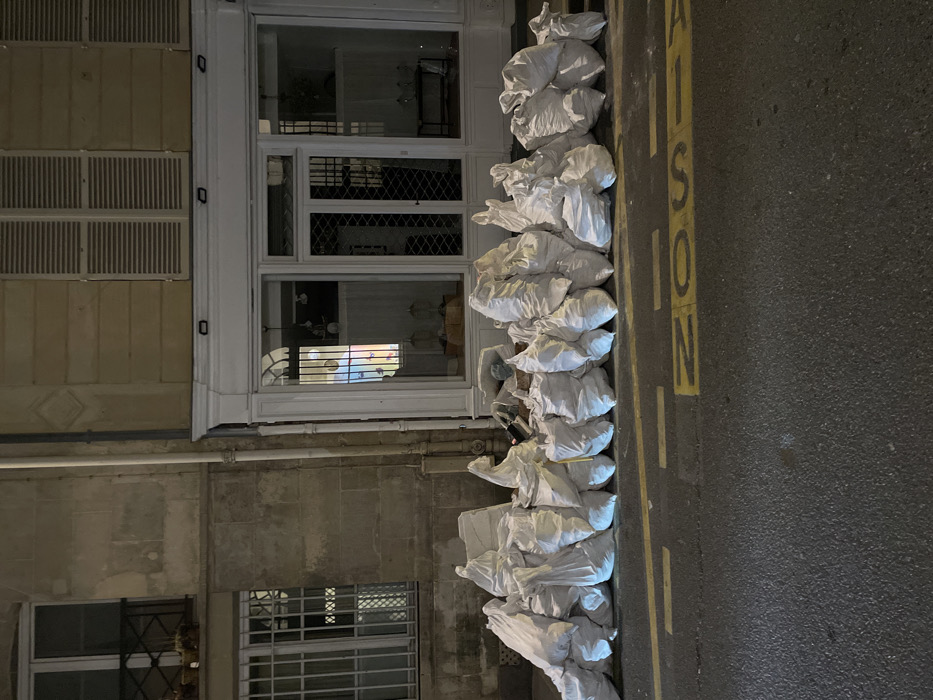 Evening snapshots capture street debris, wall art across Paris