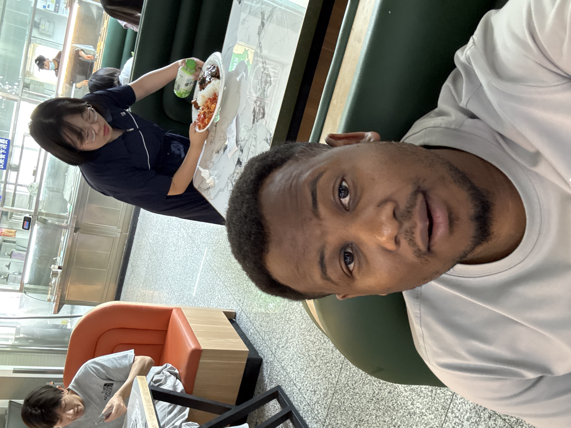 Early morning social interactions captured in Daxing District cafeteria, staircase
