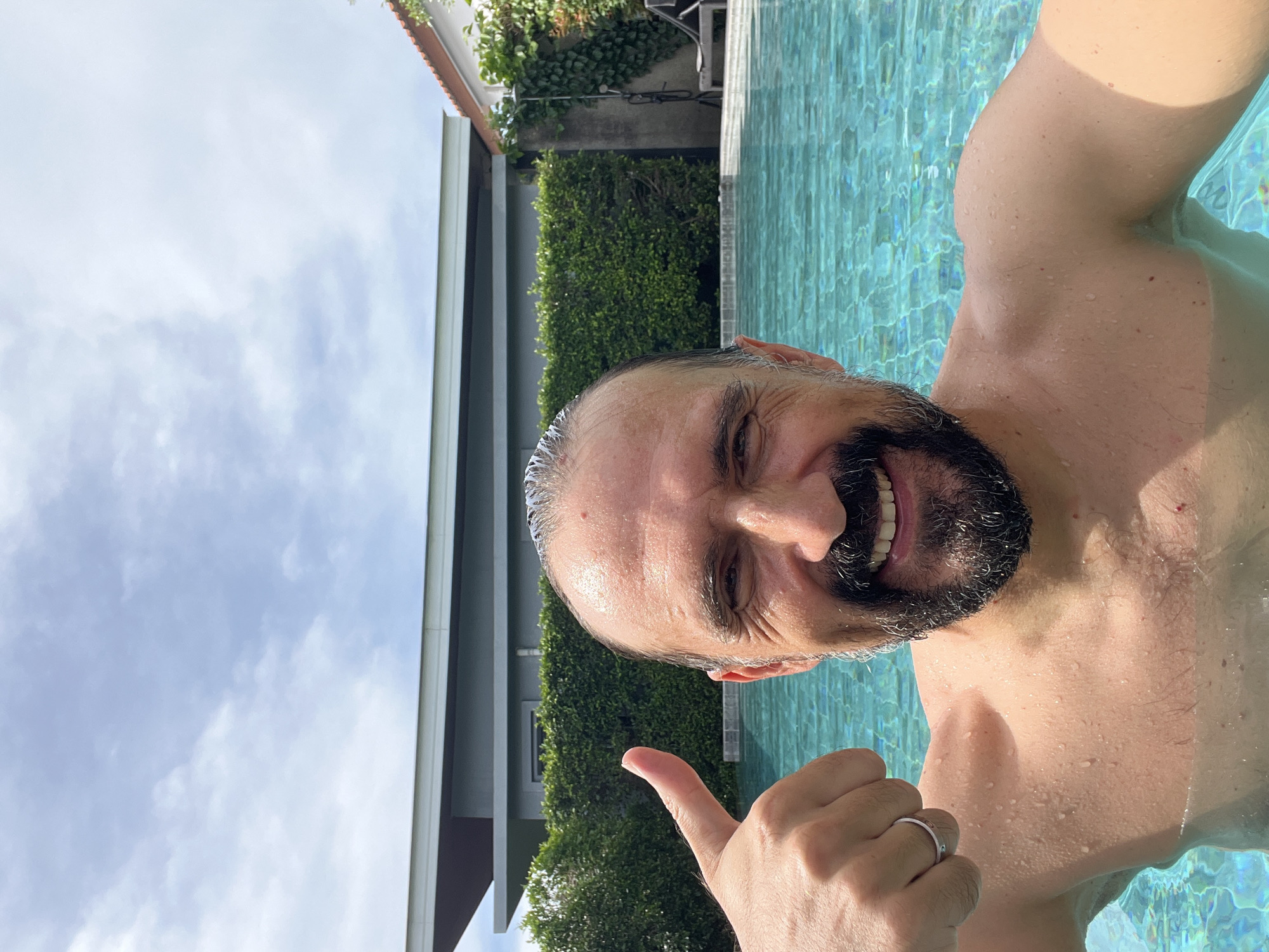 Man enjoys morning swim session in Thai pool