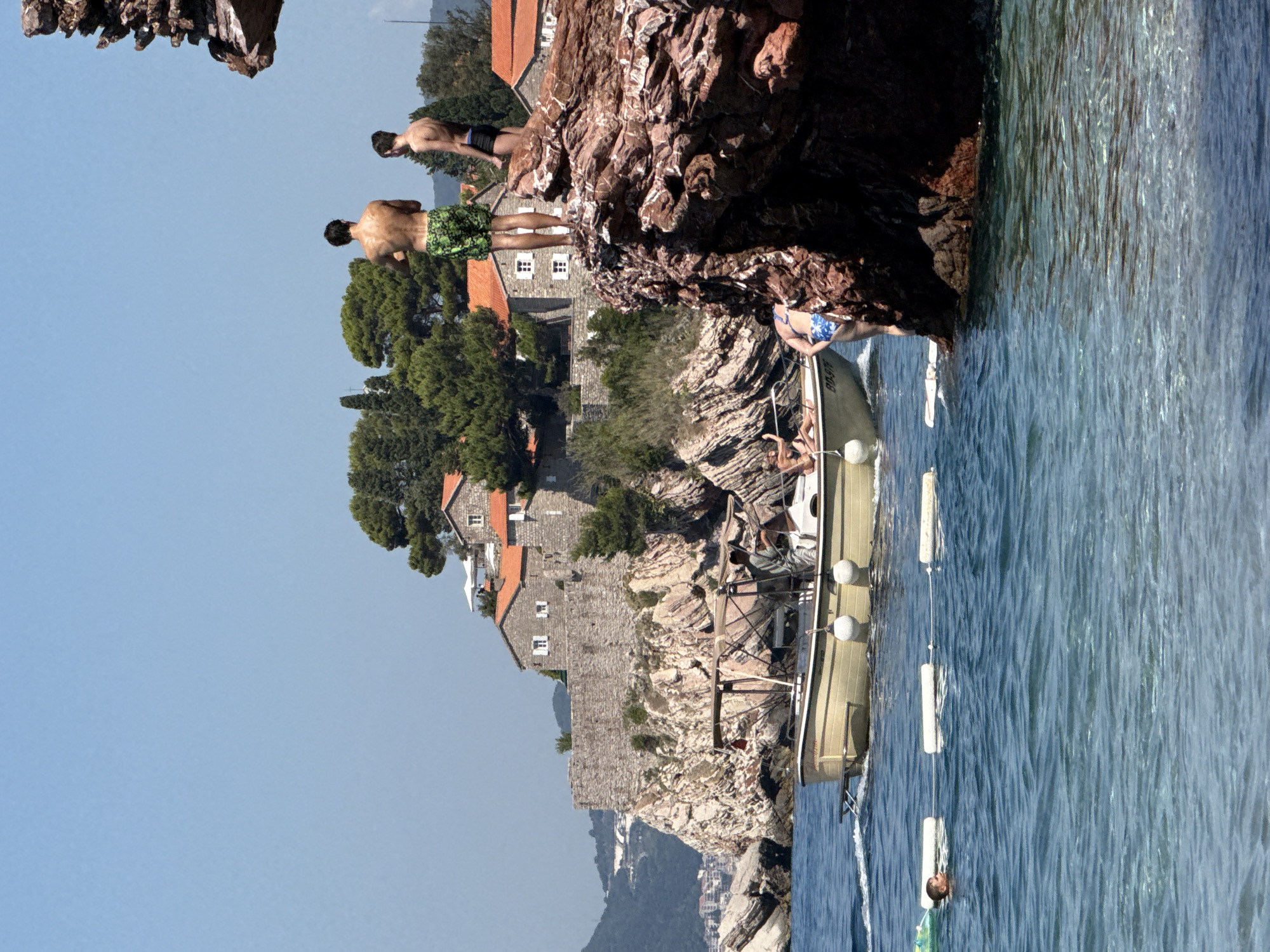 Clear Adriatic waters and rocky shoreline at Kamenovo Beach