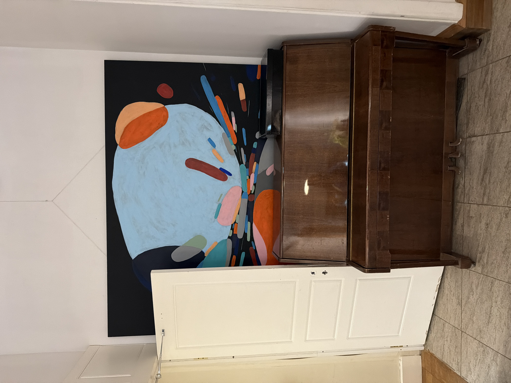 Moscow interior features abstract art and decorative books