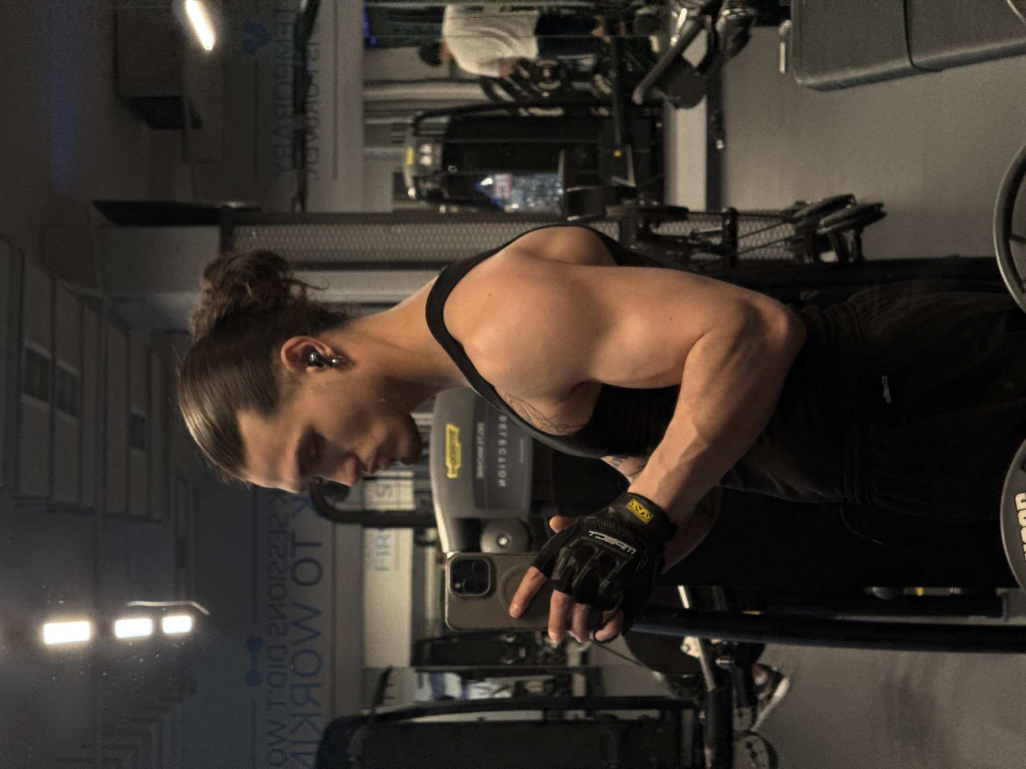 Young man takes mirror selfies at Sofia gym