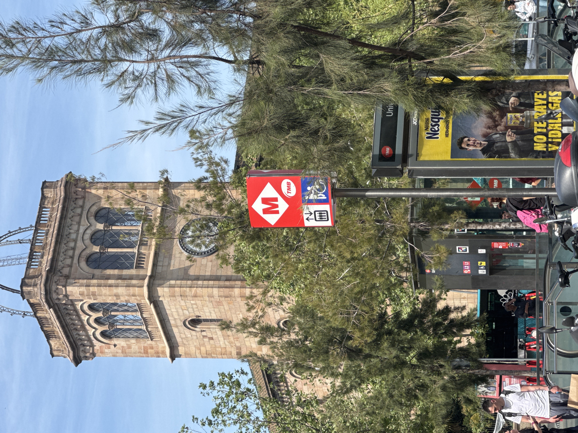 Sunny Barcelona street scene captured near metro station