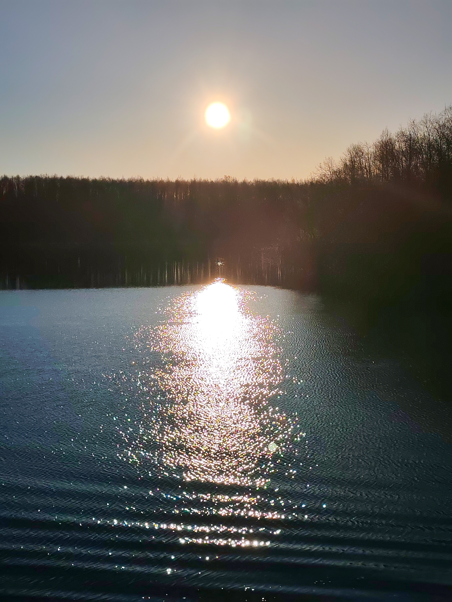 Sunset reflection photographed over water in Kurdiug, Russia