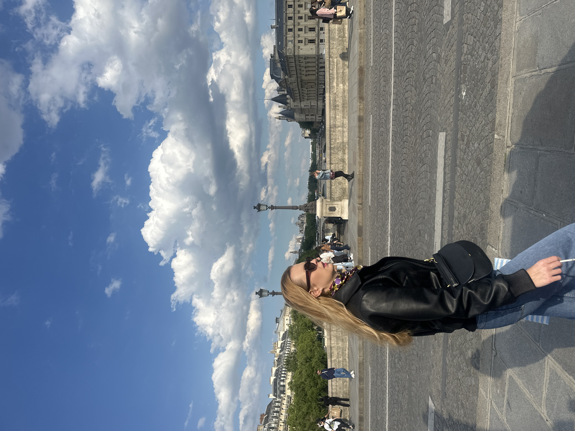 Casual street scenes unfold across central Paris Friday afternoon