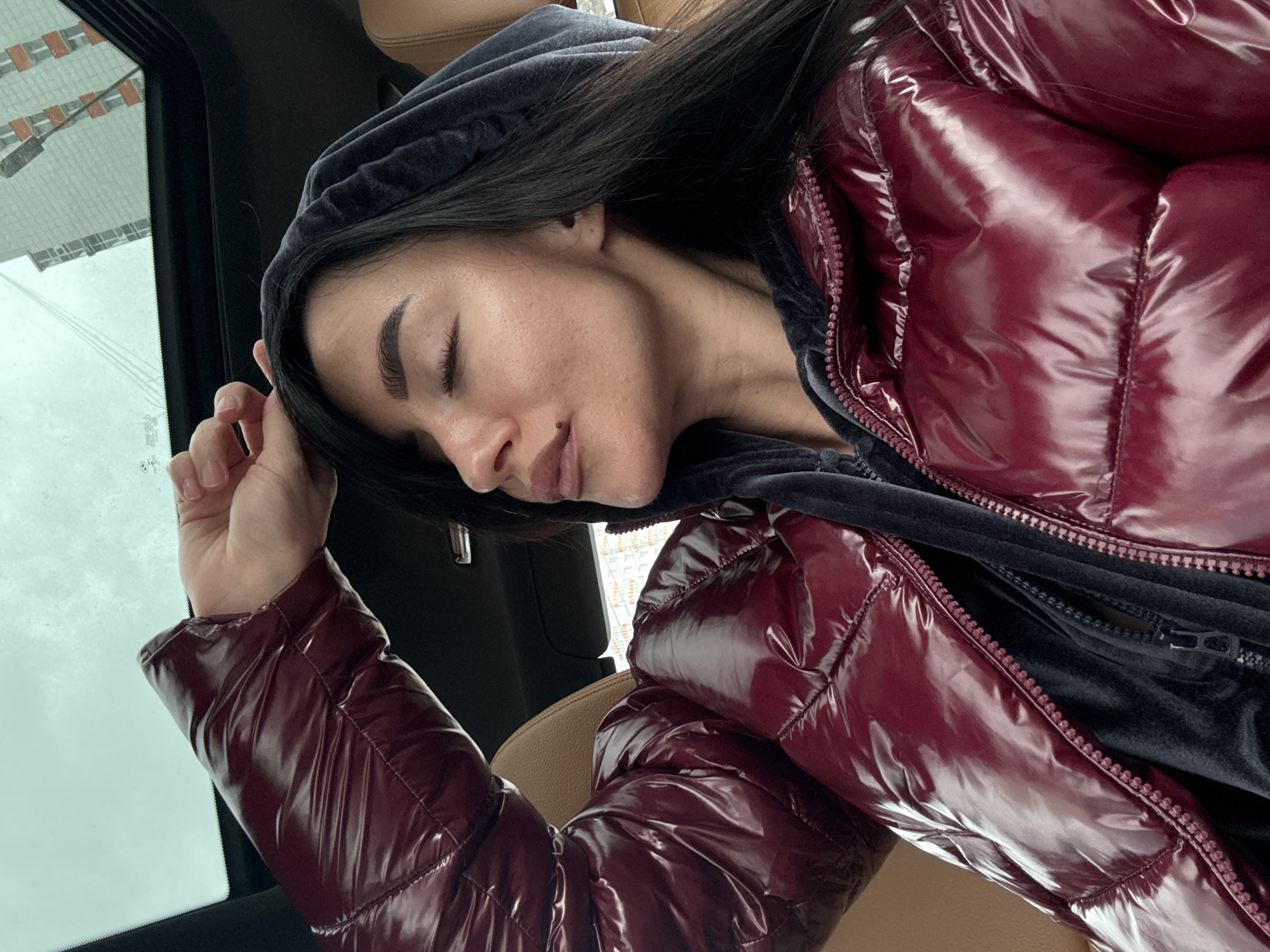 Woman rests in car in Krasnoyarsk