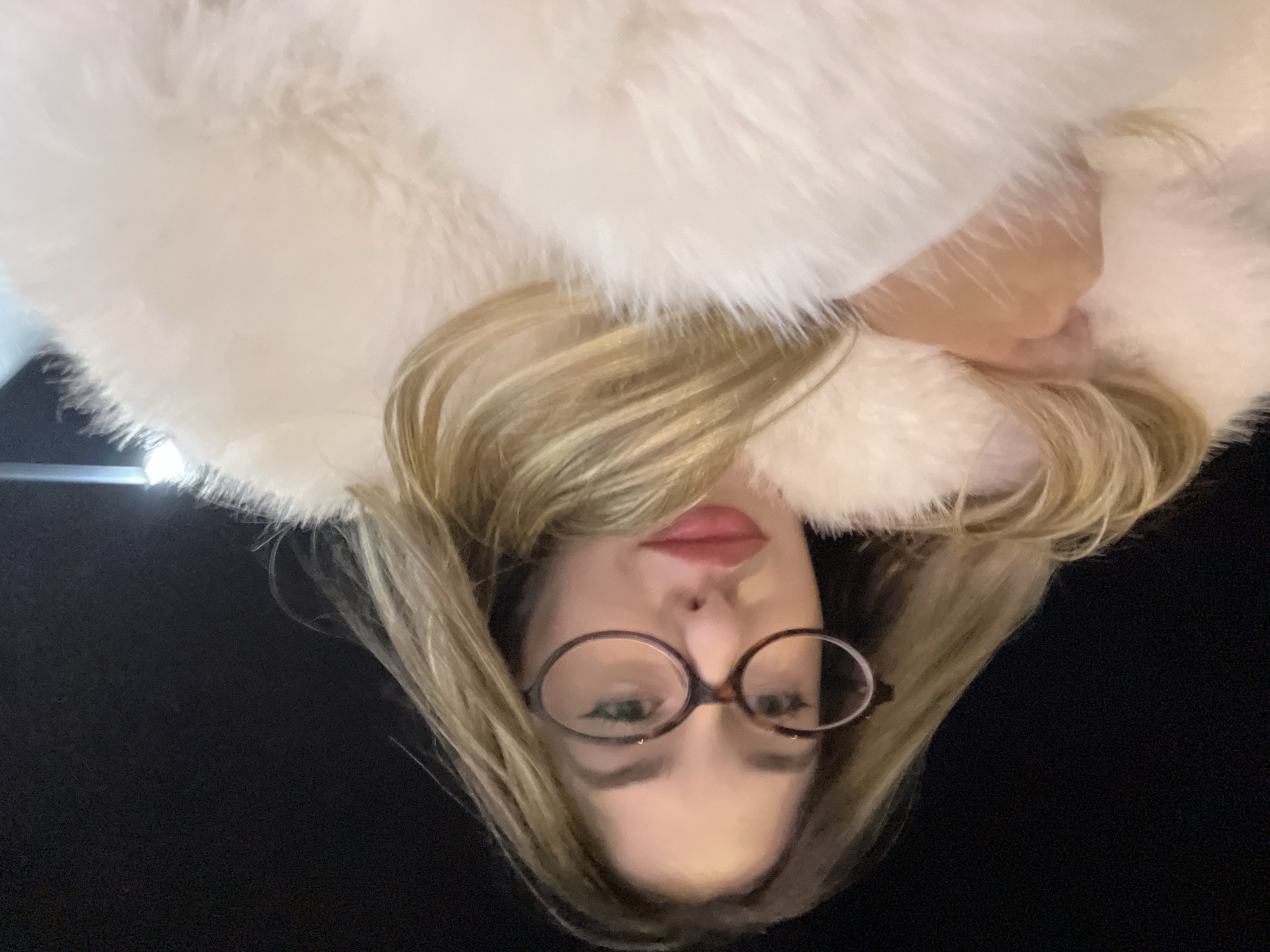 Woman in white fur coat documented across Sofia locations