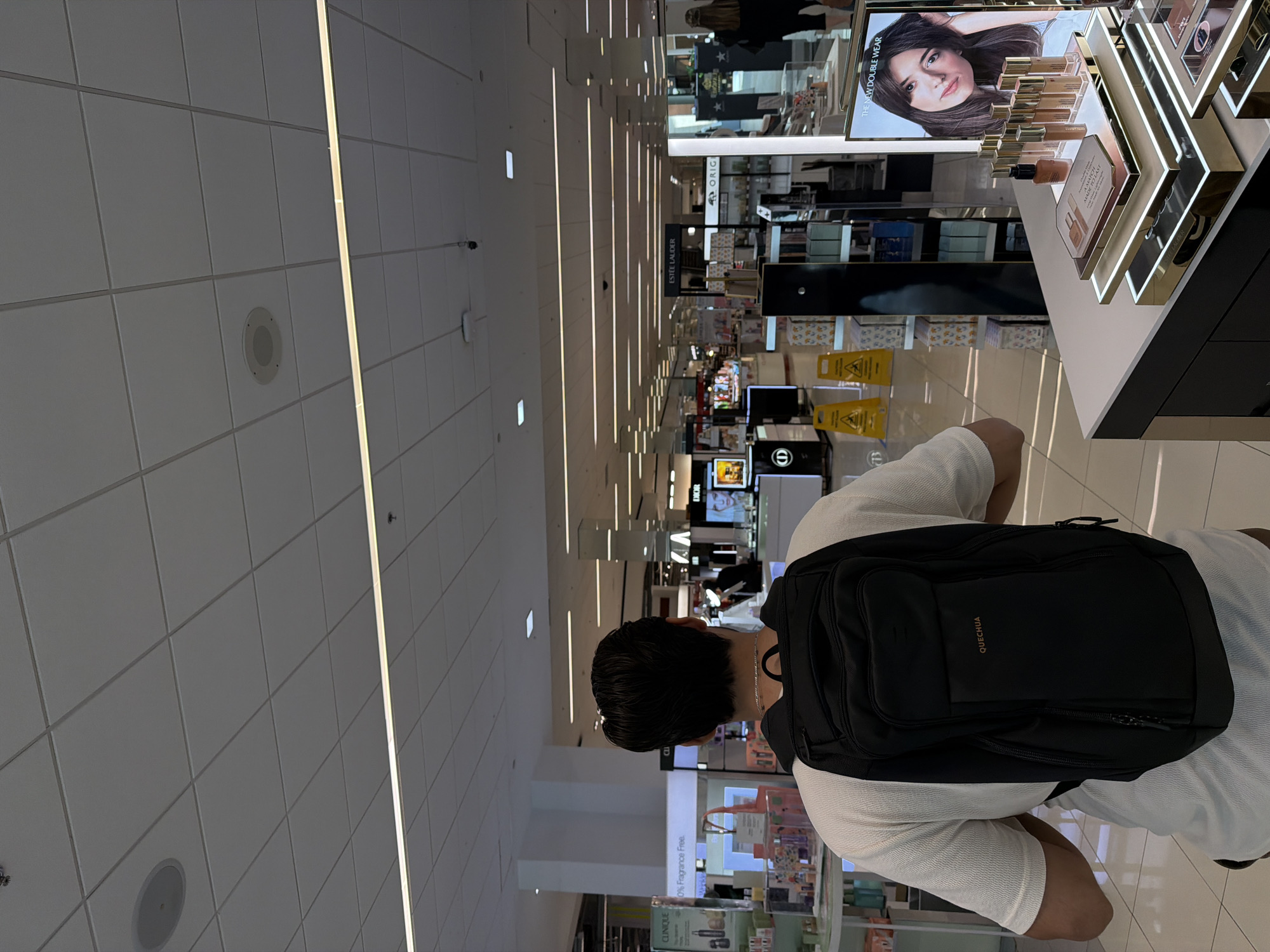 Man with backpack shops in Atlanta department store