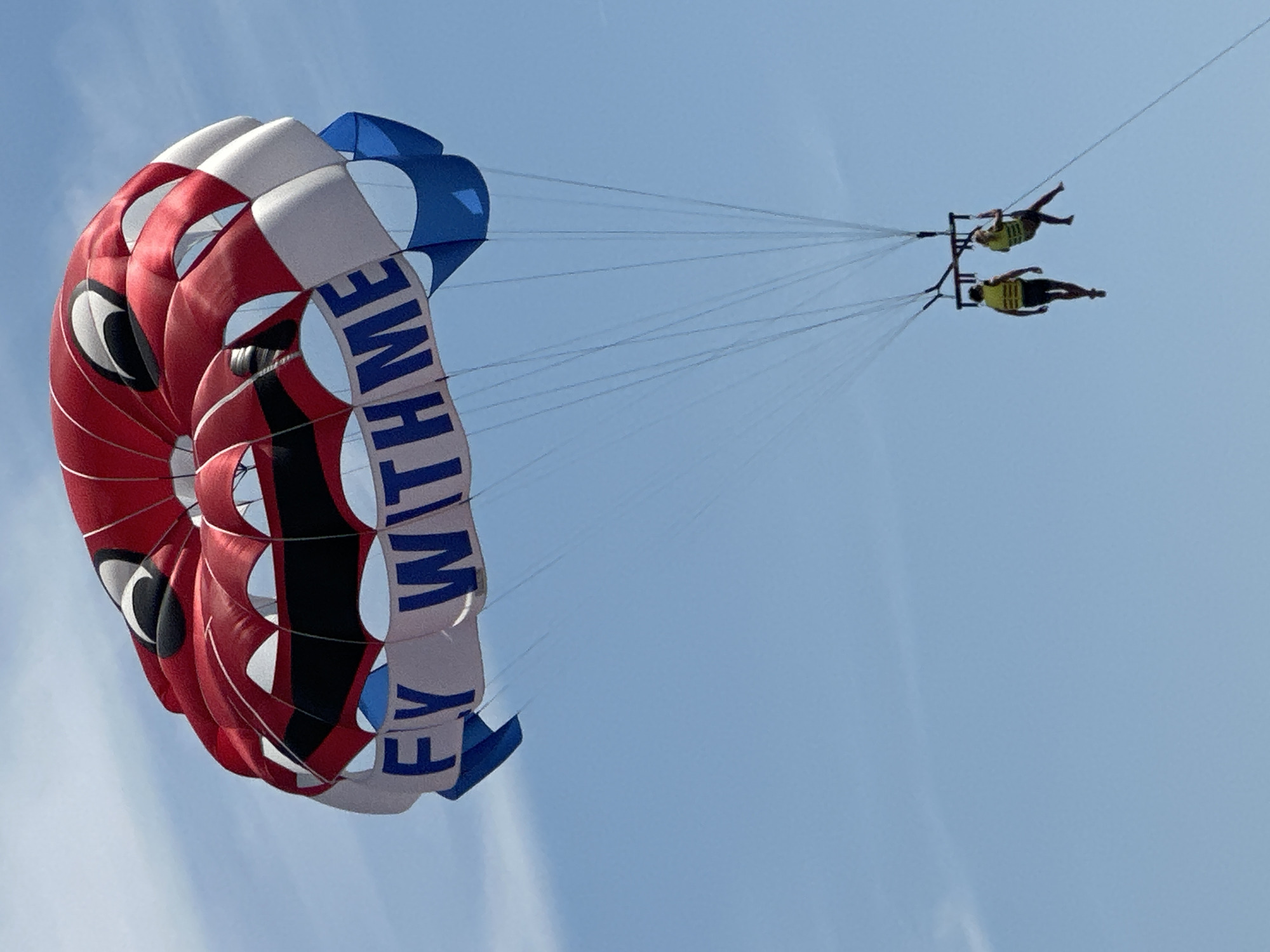 Parasailers fill skies above Budva Montenegro coastline