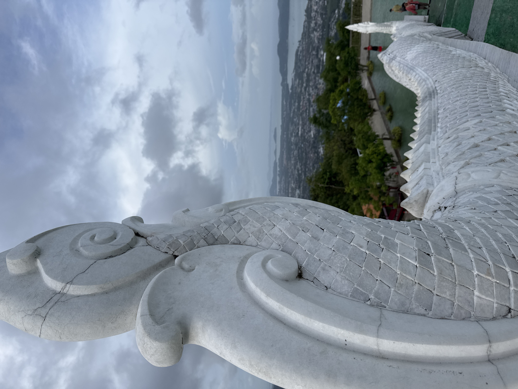 Cracked white serpent sculpture observed in Chalong, Thailand