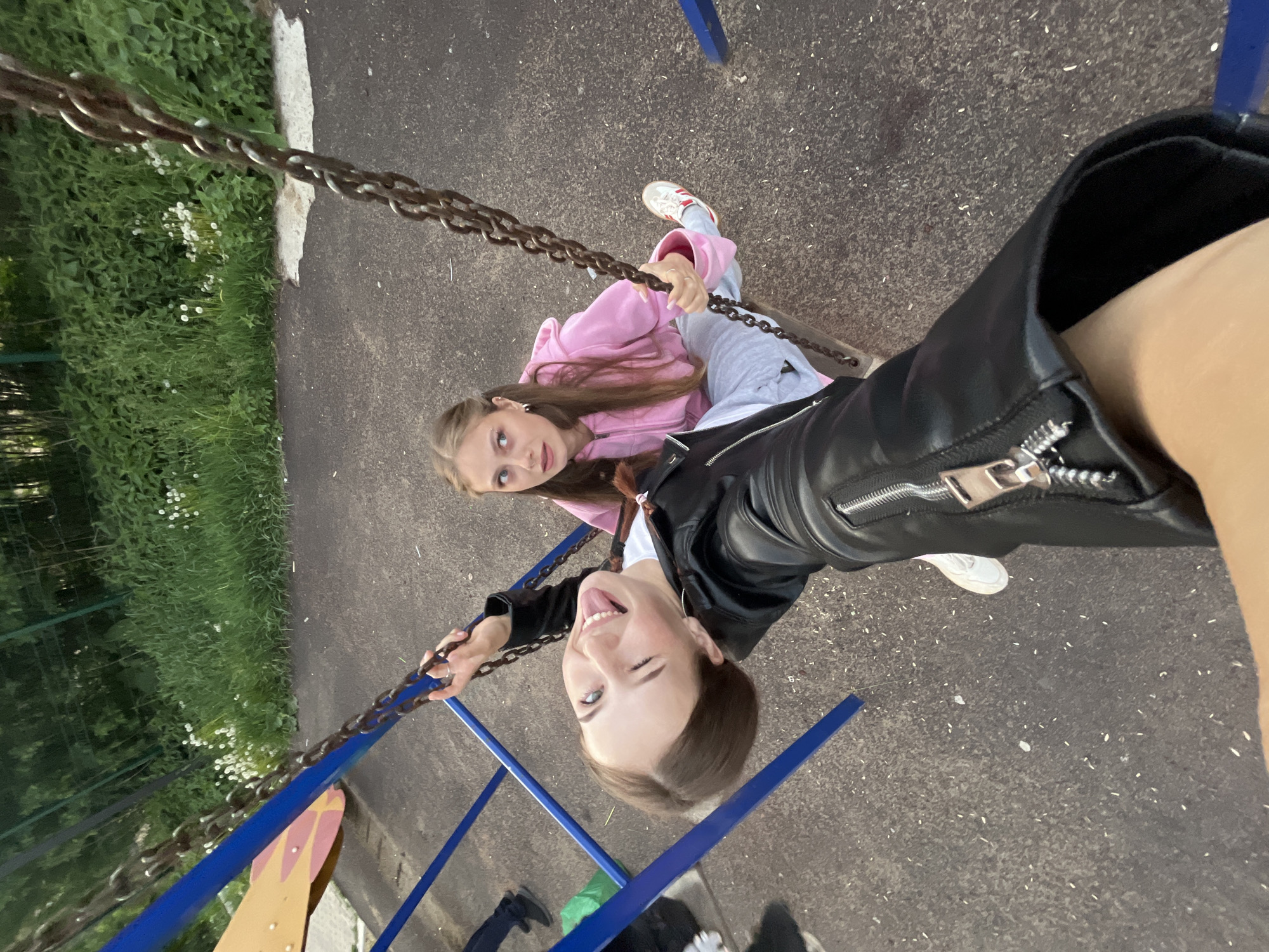 Friends enjoy afternoon playground time in Russian village