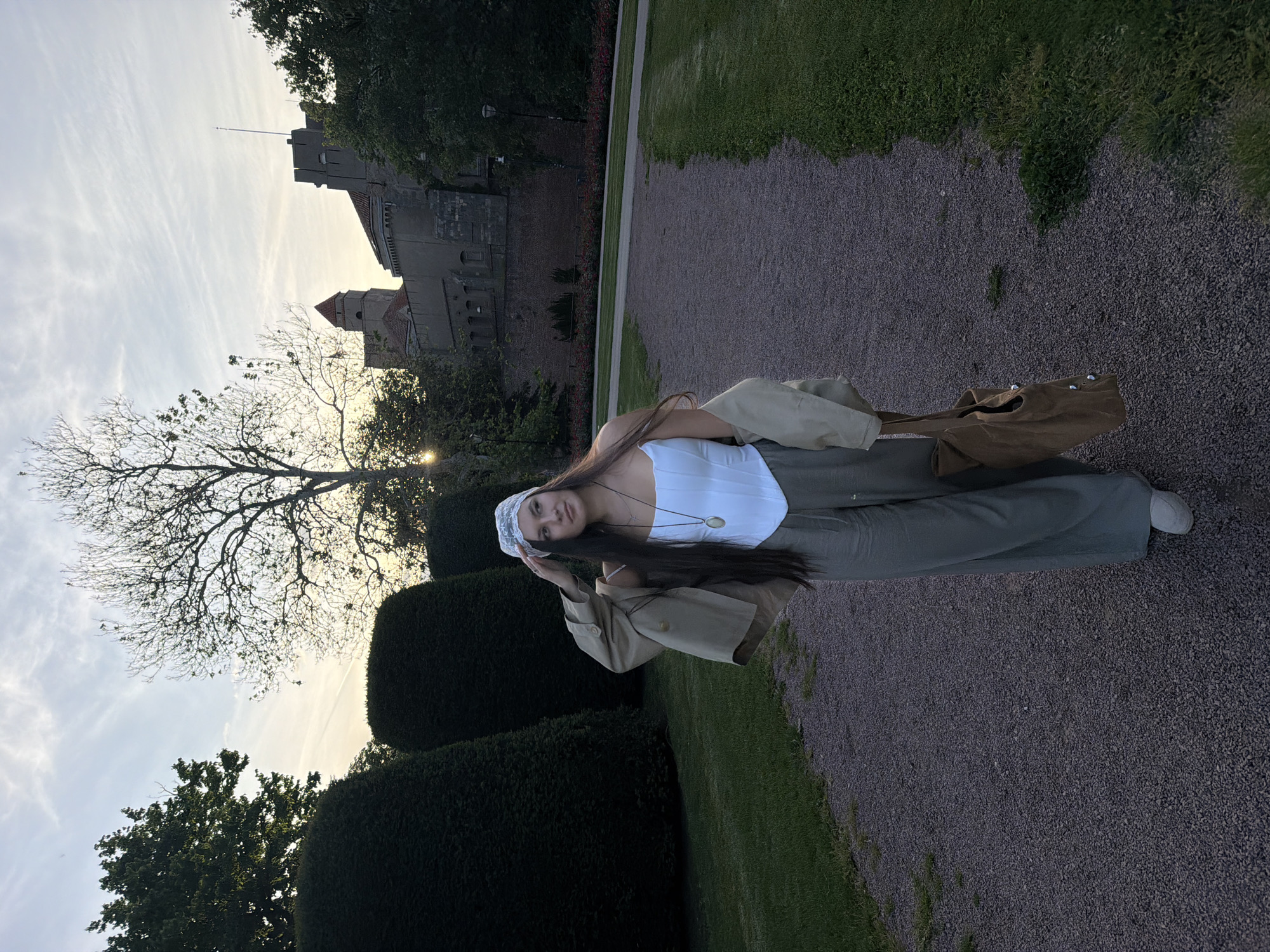 Woman in period-style outfit photographed around Belgrade parks, buildings