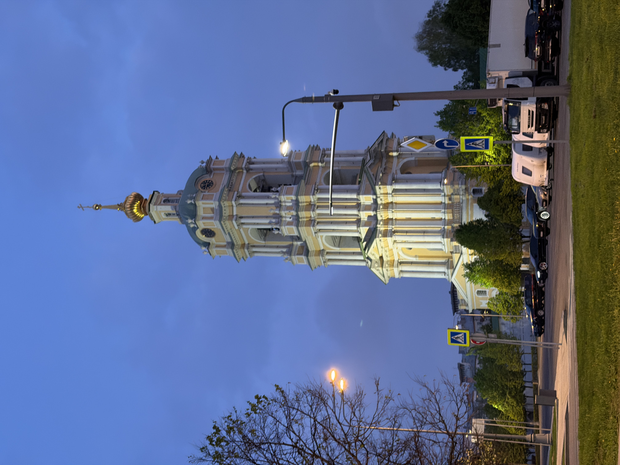Moscow evening captured: historic church, traffic jam, twilight streets