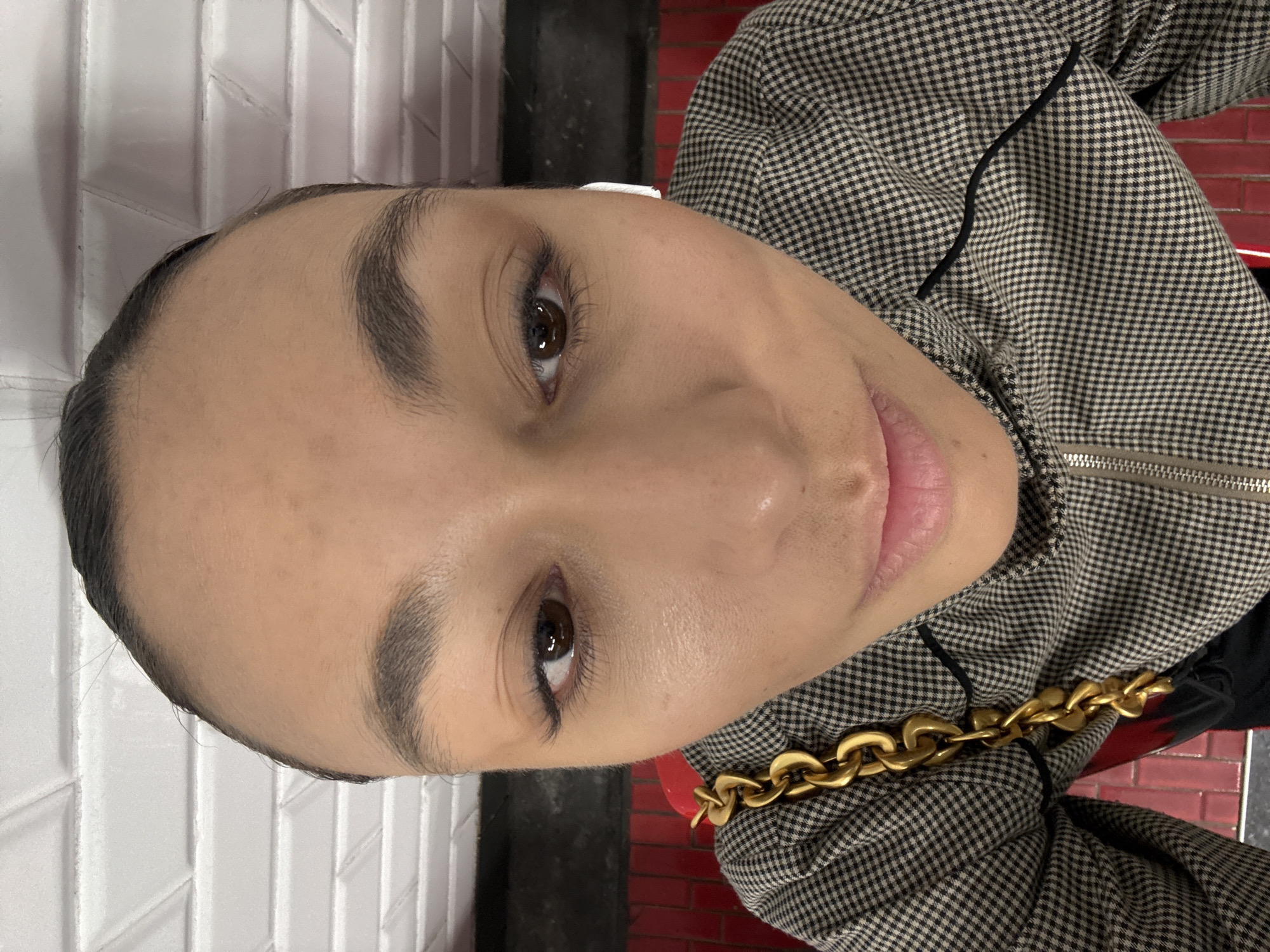 Person takes selfies at Clichy metro station