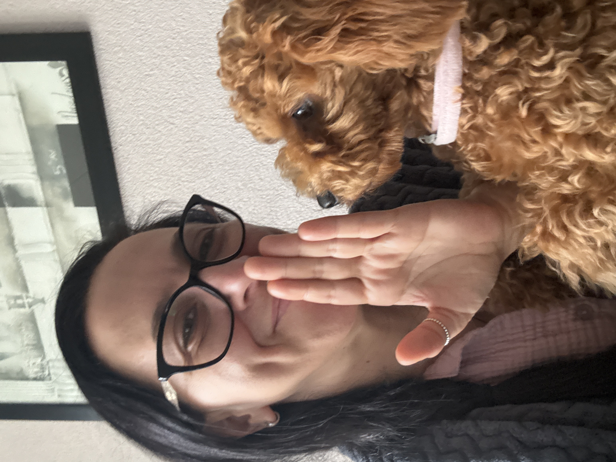 Woman and poodle share quiet morning moments in Netherlands home