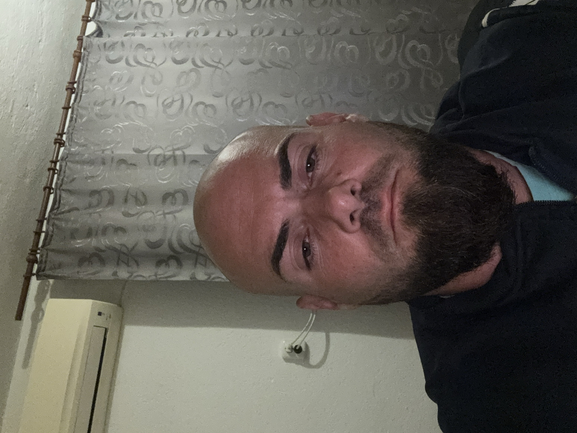 Man documents evening routine with selfies in Bulgarian home