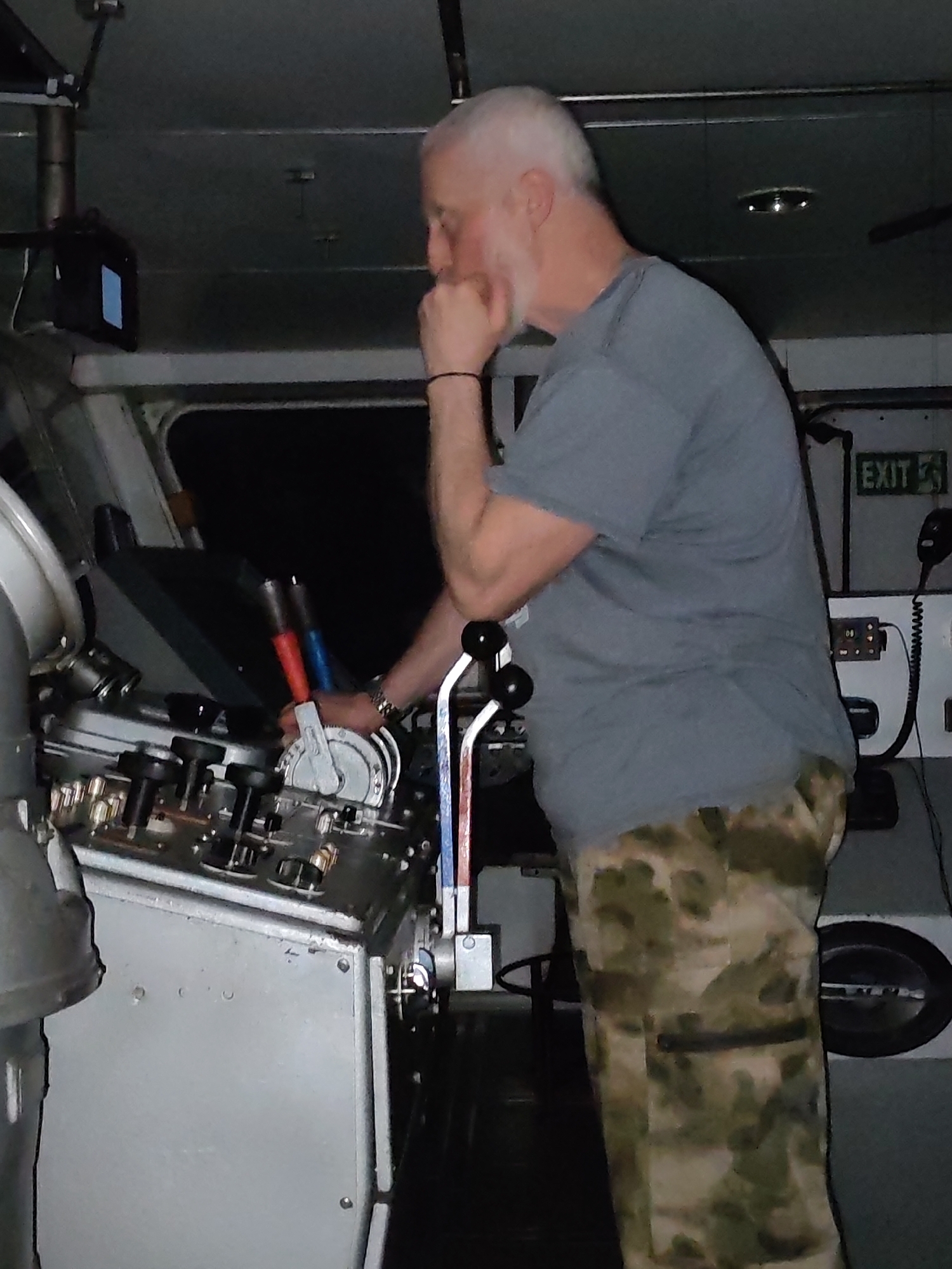 Bearded man spotted in vessel control room, hand to chin