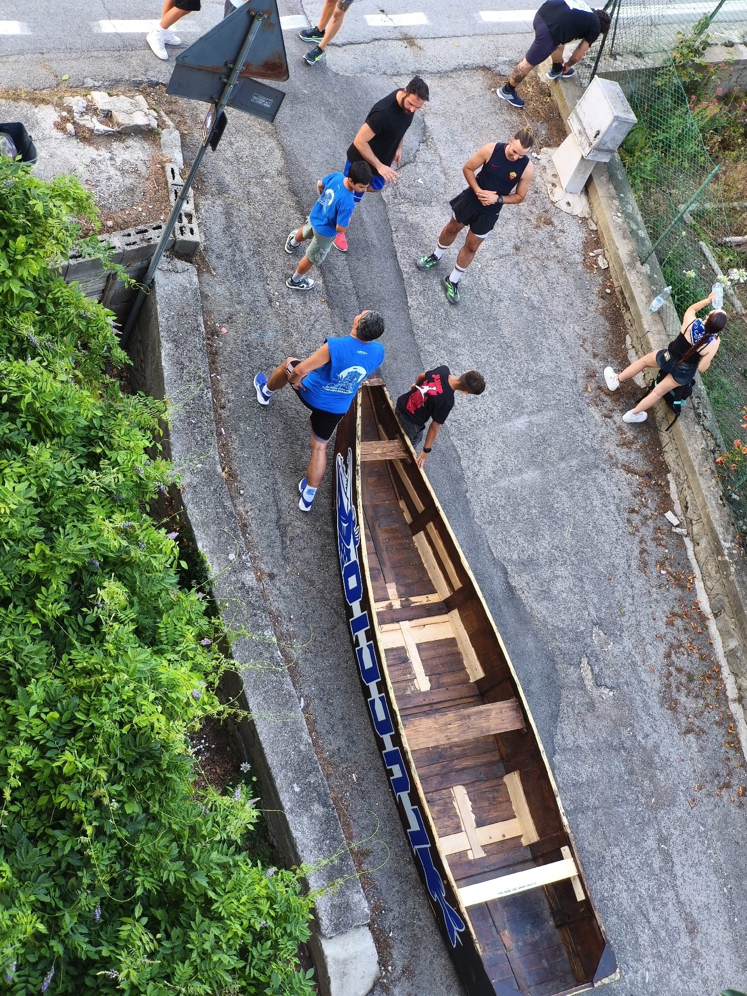 Sports team activity and lakeside life in Passignano sul Trasimeno
