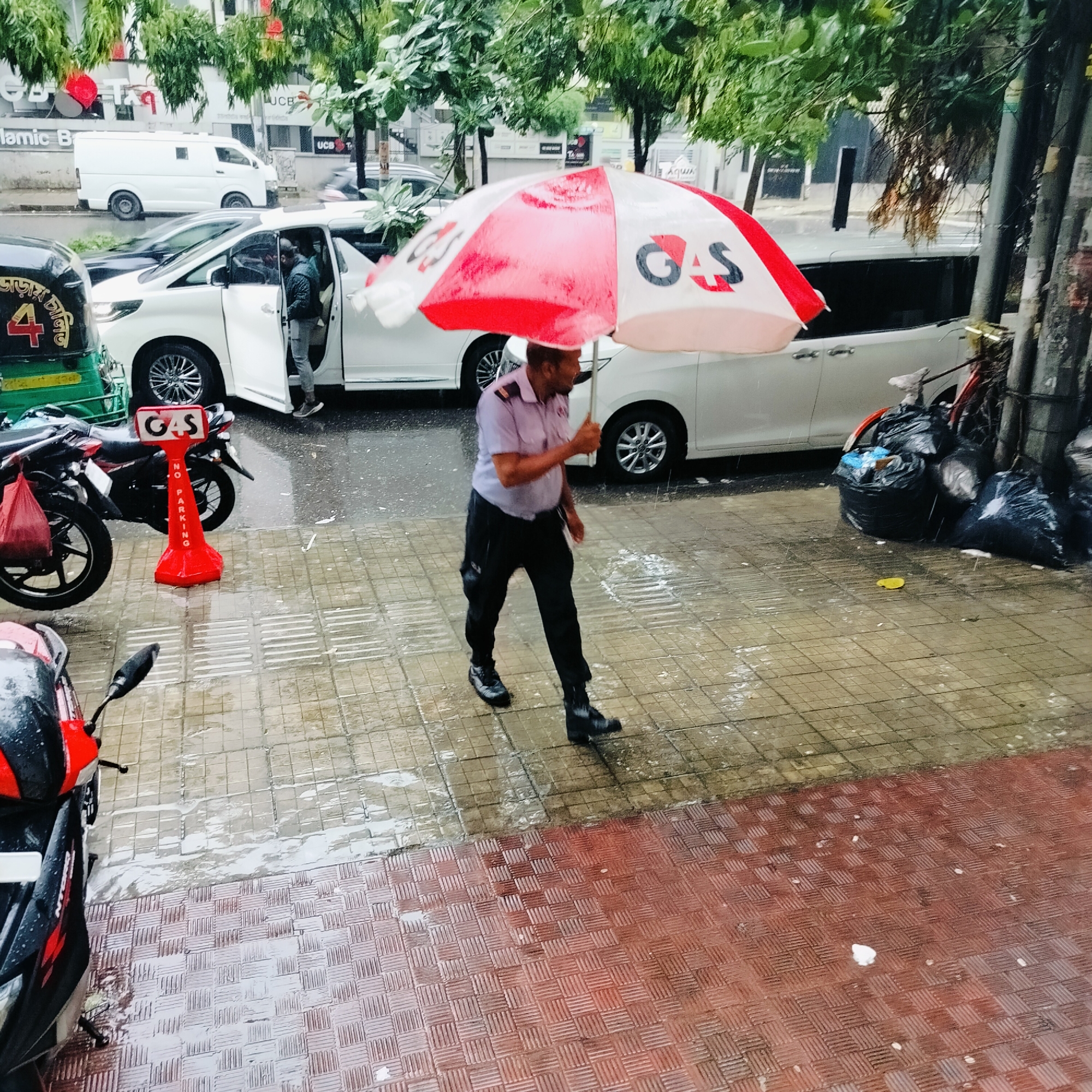 Rainy morning street life captured across Dhaka, Bangladesh